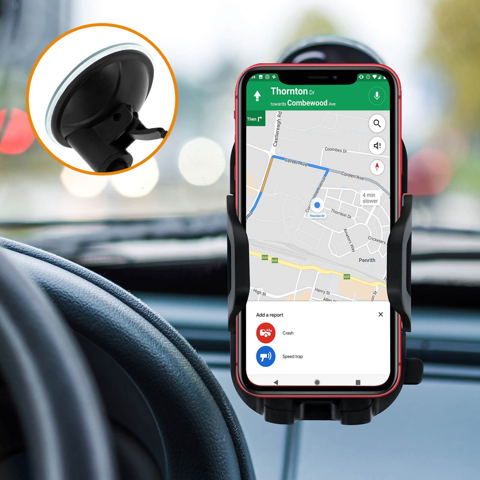 Telefon in Autohalterung, zeigt Navigations-App. Armaturenbrett und Windschutzscheibe sichtbar.