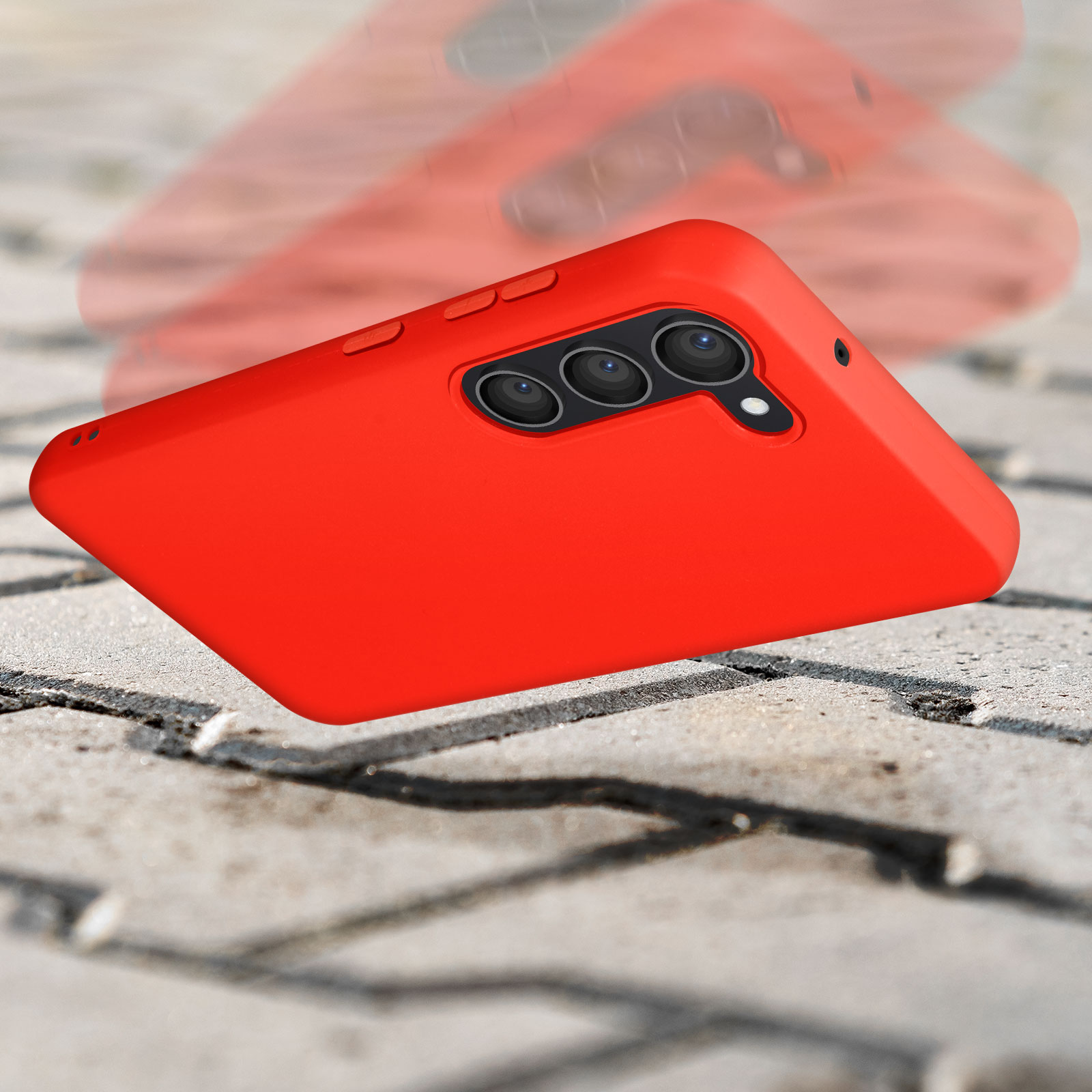 Una custodia rossa per telefono cade su una superficie di pietra. La custodia è rivolta verso l'alto.