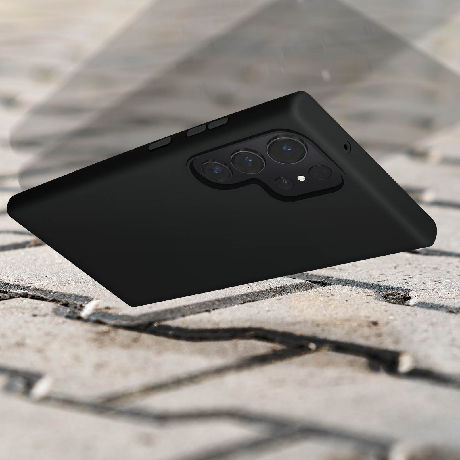 Czarne etui na telefon leżące na teksturowanej powierzchni. Widoczne obiektywy aparatu.