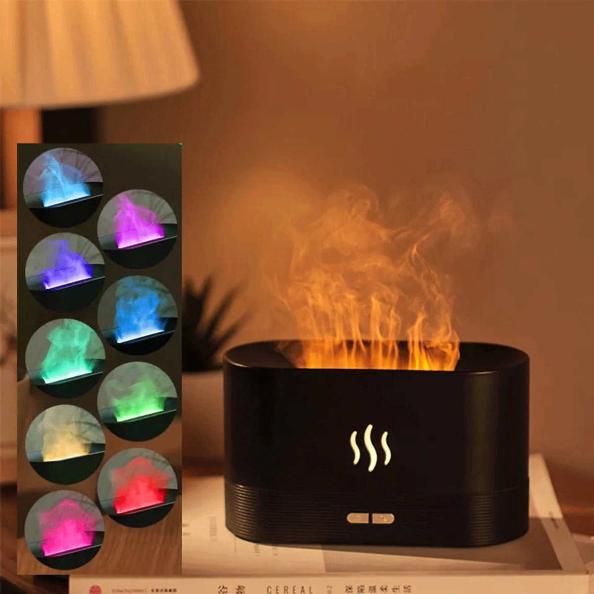 Humidificador de aire negro con forma de llama, con opciones de color y un libro sobre una superficie marrón.