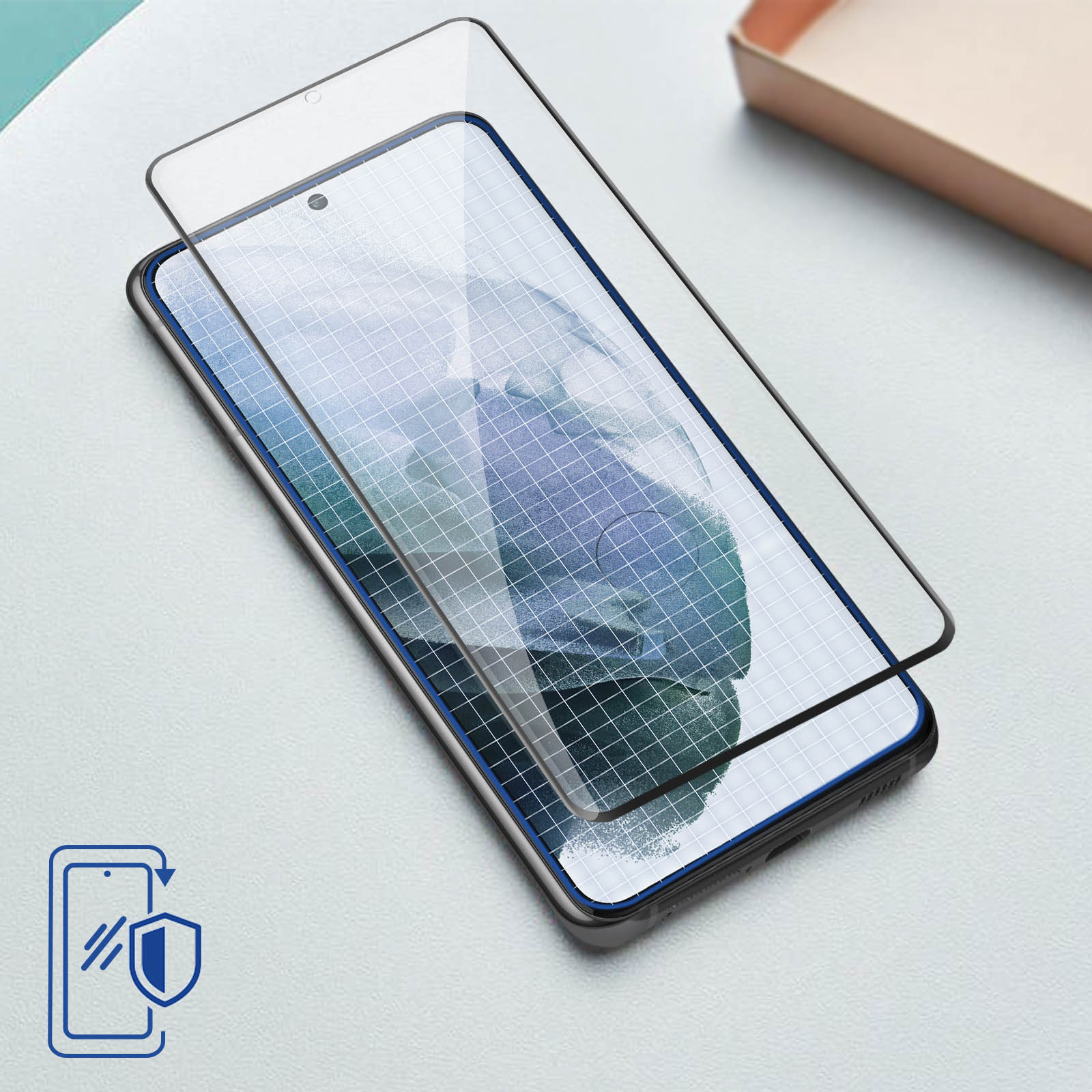 Telefon z nałożoną folią ochronną. Telefon ma ikonę tarczy.