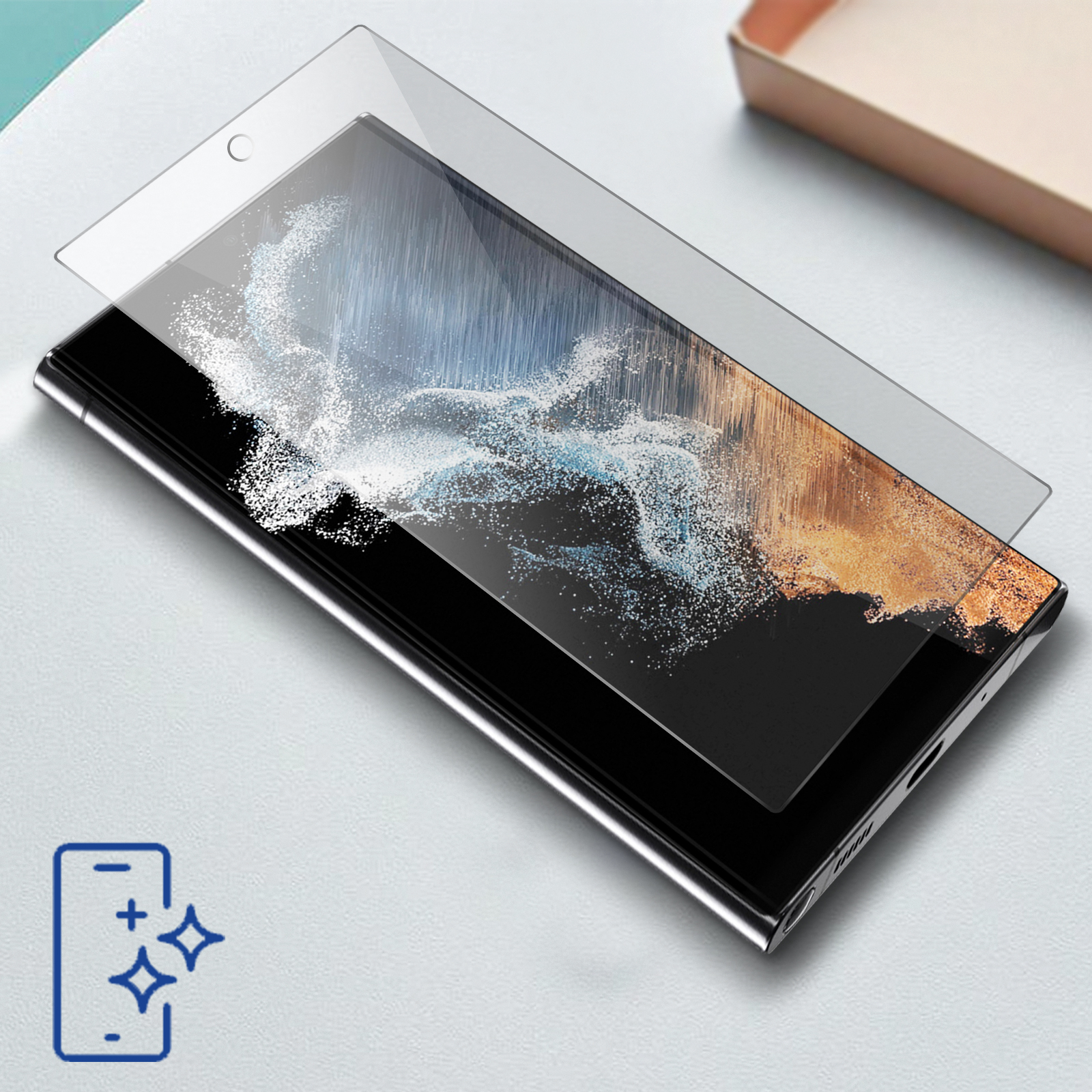 Telefon z ochraniaczem ekranu. Telefon ma ciemny ekran. Tło stanowi jasna powierzchnia.