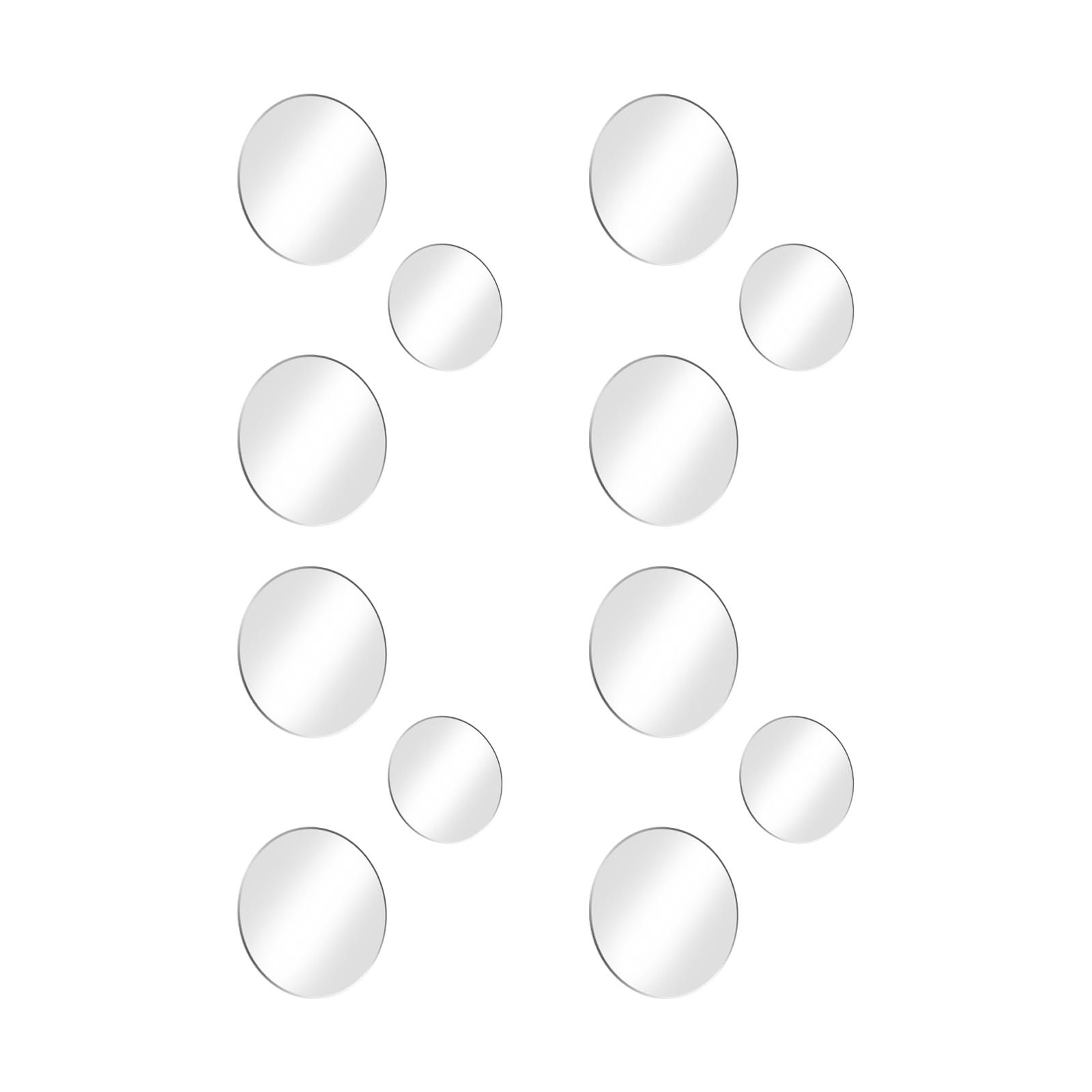 Nove specchi rotondi di varie dimensioni sono disposti su sfondo bianco.