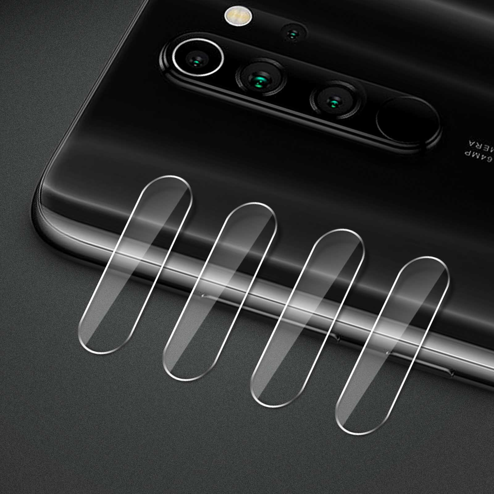 Czarny tył telefonu z obiektywami aparatu i ochraniaczami. Cztery przezroczyste ochraniacze są umieszczone na telefonie.