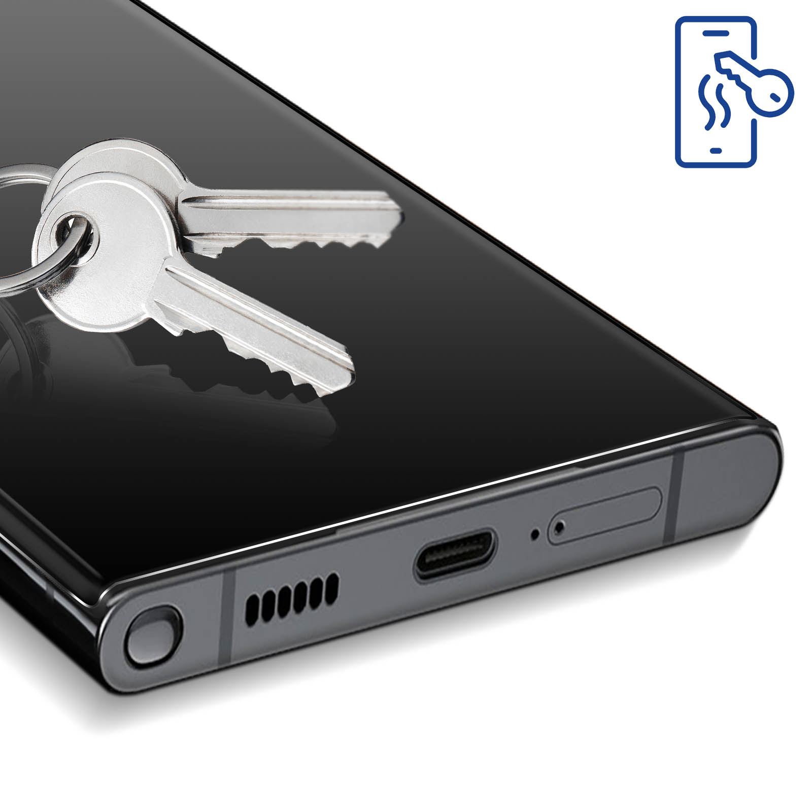 Czarny telefon z kluczami na nim. Ikona klucza znajduje się w prawym górnym rogu. Telefon ma port ładowania i głośniki.