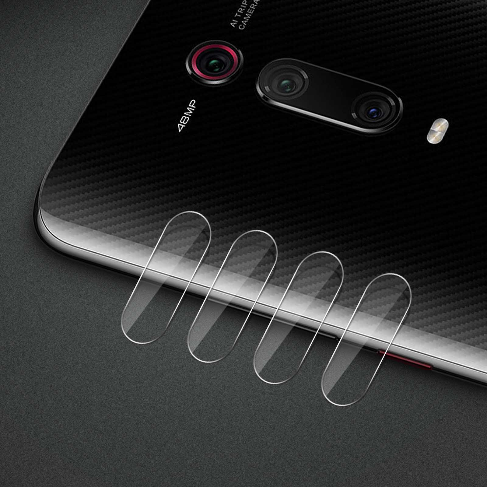 Tył czarnego telefonu z osłoną aparatu. Widoczne są cztery przezroczyste osłony, umieszczone na aparatach telefonu.