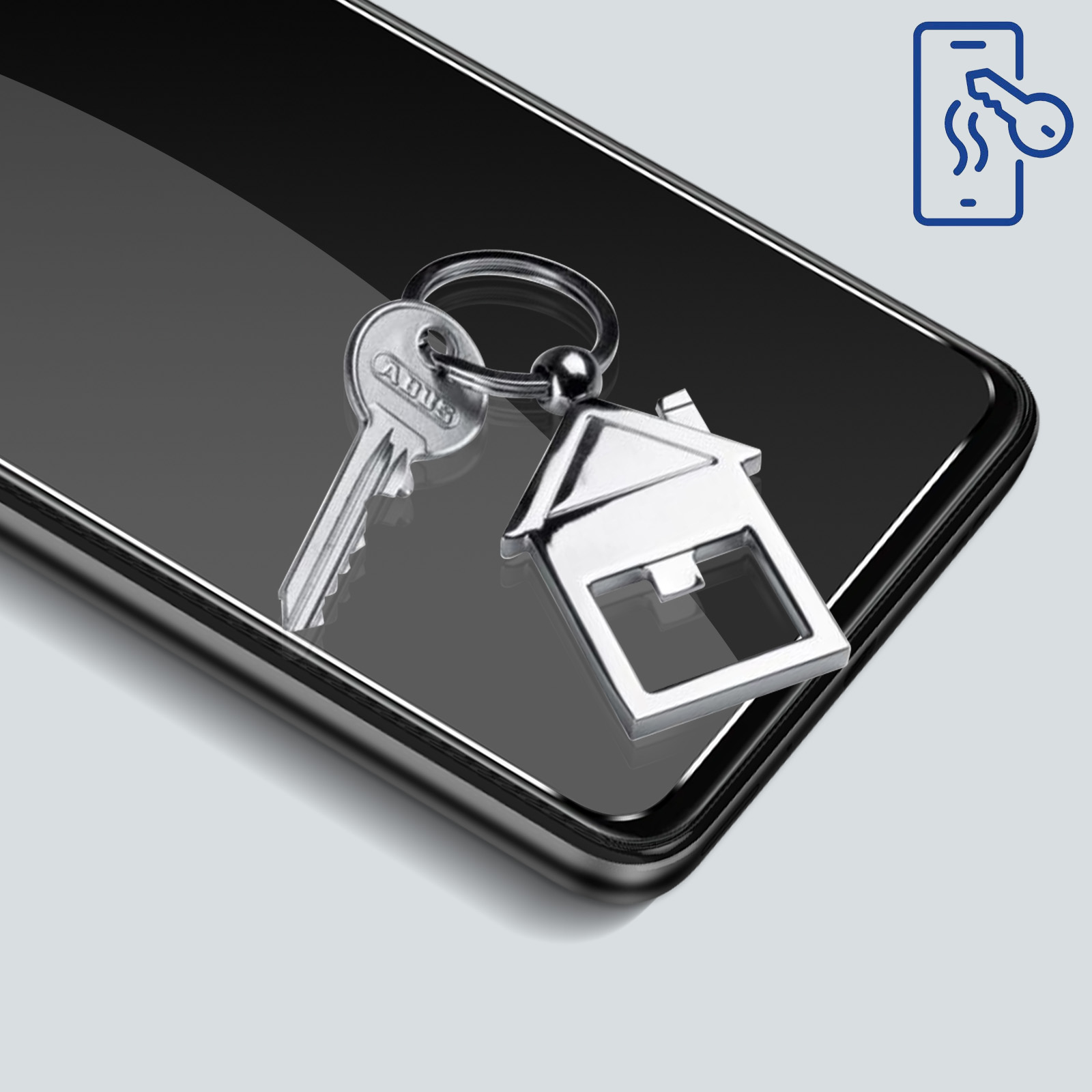 Una chiave e un portachiavi a forma di casa poggiano su uno smartphone nero. Un'icona a forma di chiave appare in alto a destra.