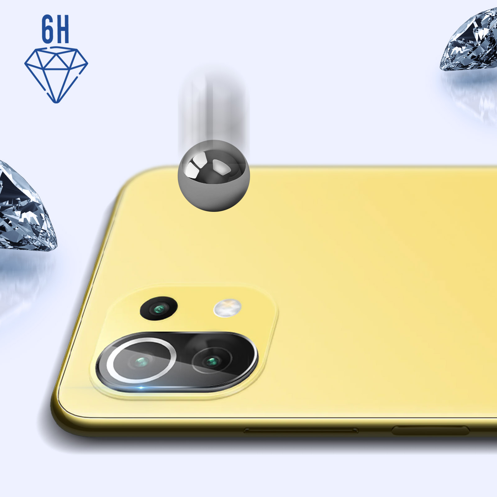 Ein Telefon mit gelber Rückseite und fallender Metallkugel. Zwei Diamanten auf beiden Seiten.