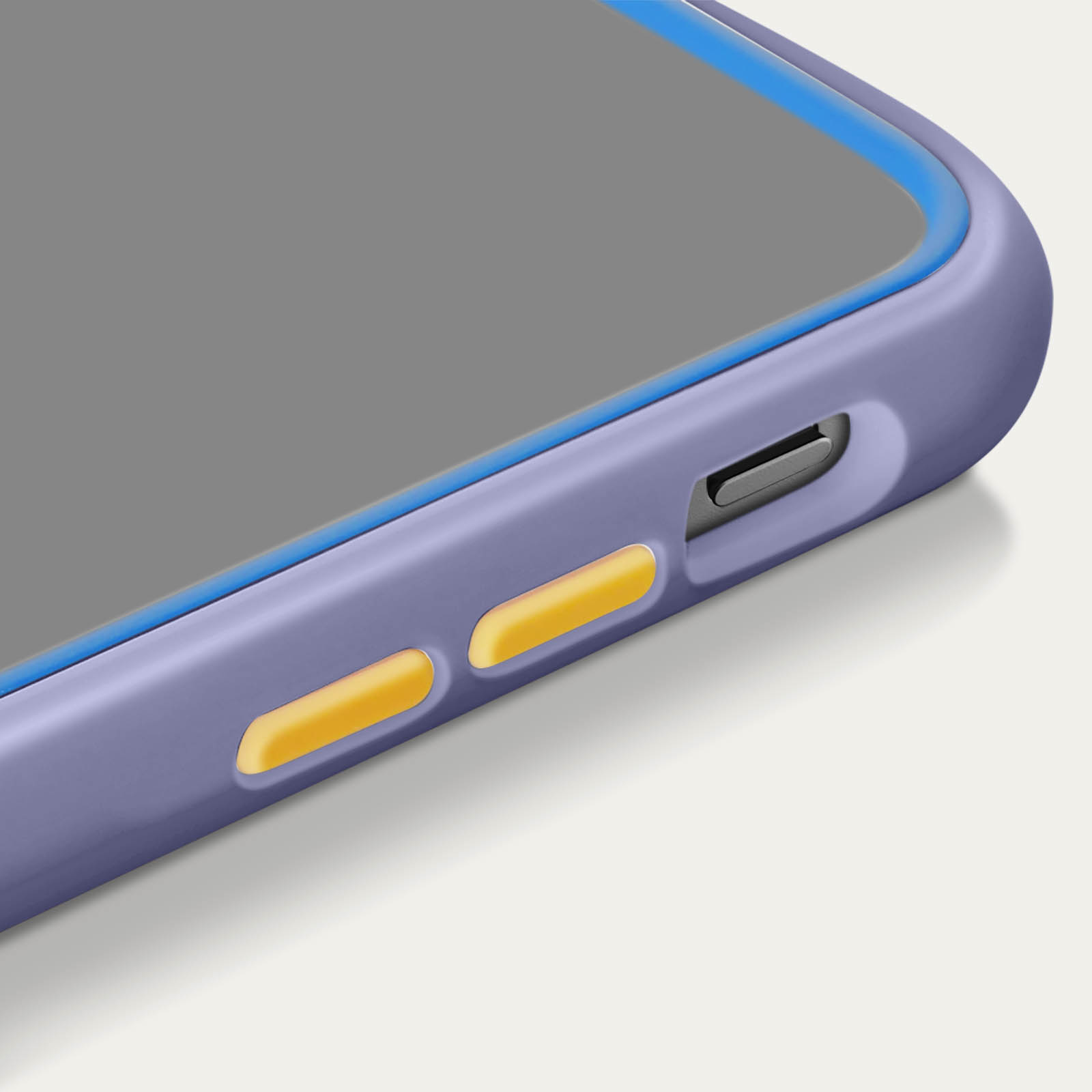 Custodia per telefono viola con dettagli blu e gialli. Primo piano dei pulsanti e del lato.