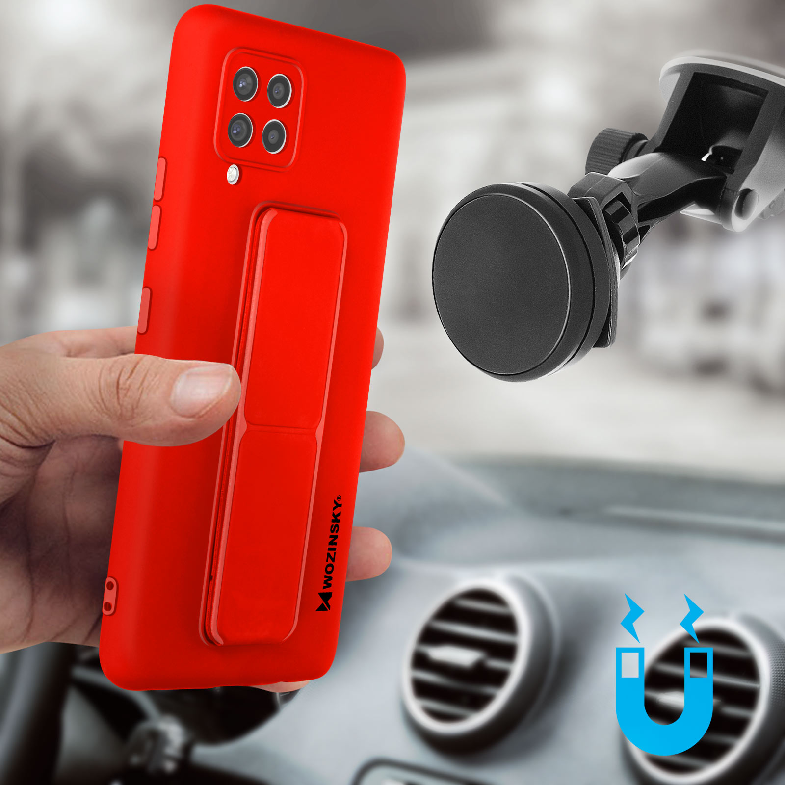 Dłoń trzyma czerwoną obudowę telefonu. Uchwyt samochodowy w tle, z deską rozdzielczą.