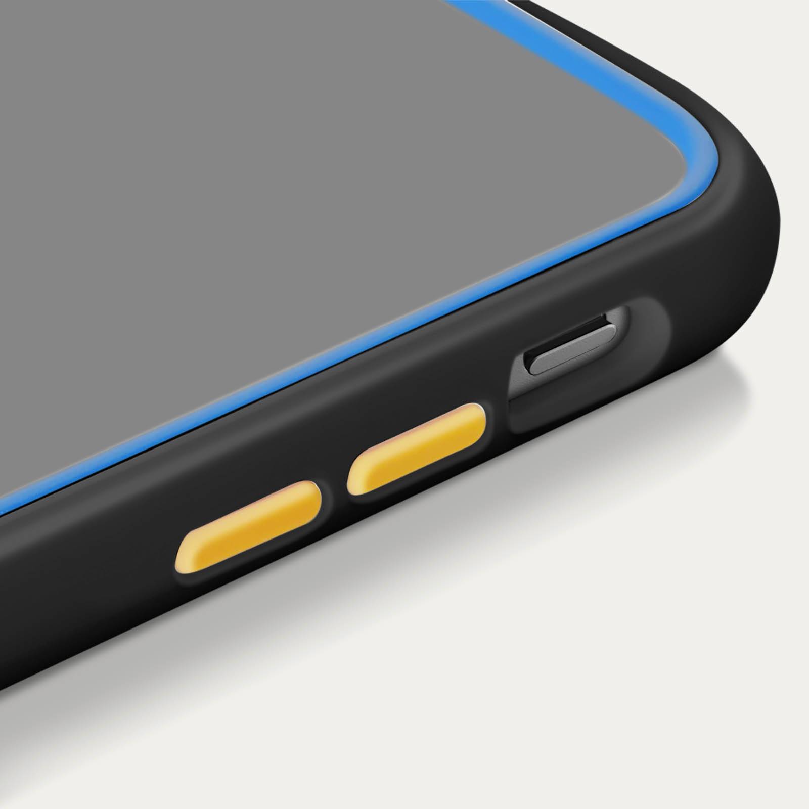 Un primo piano dei pulsanti di una custodia per telefono, con pulsanti gialli e un bordo blu.