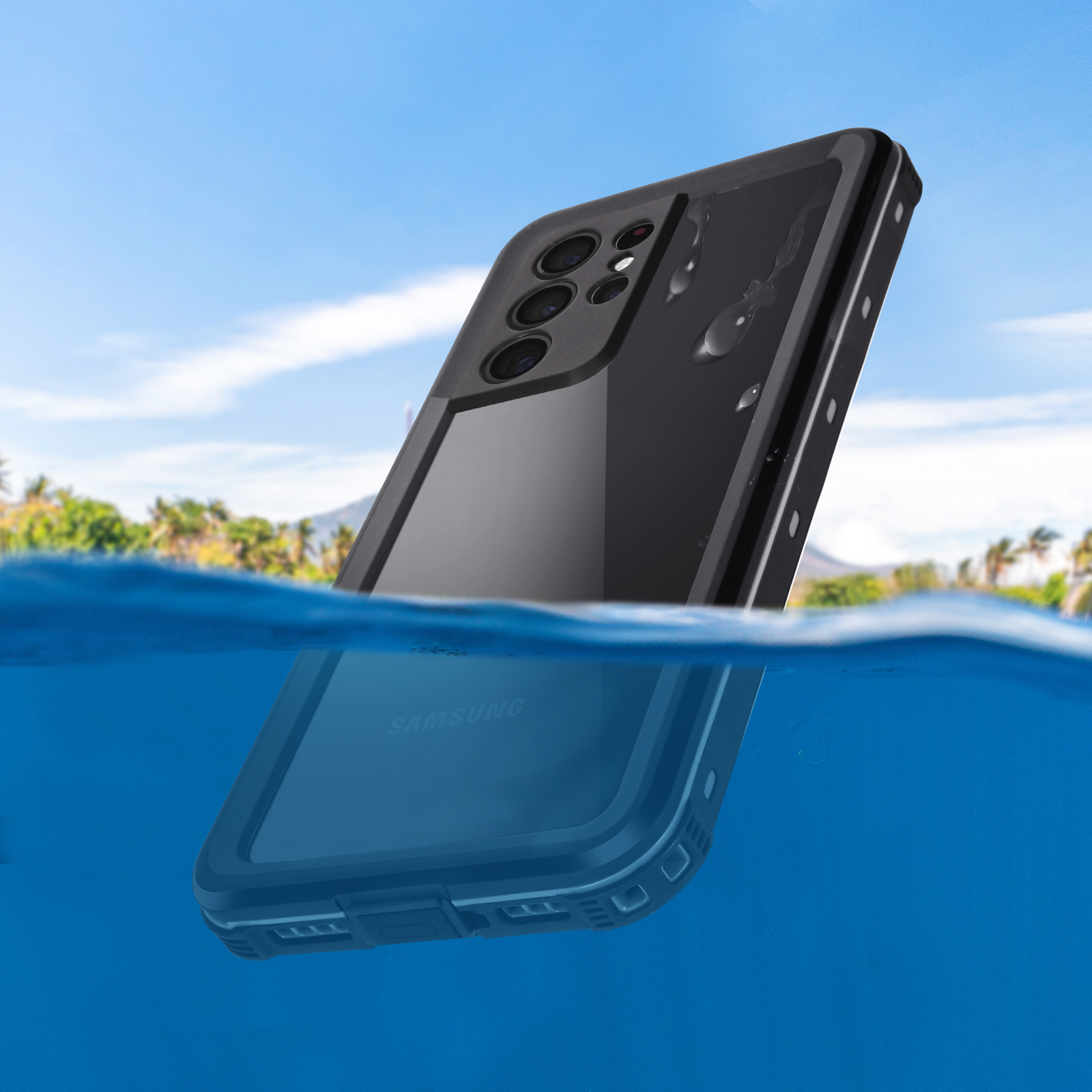 Telefono nero in acqua, logo Samsung visibile. Acqua blu e cielo con alberi sullo sfondo.