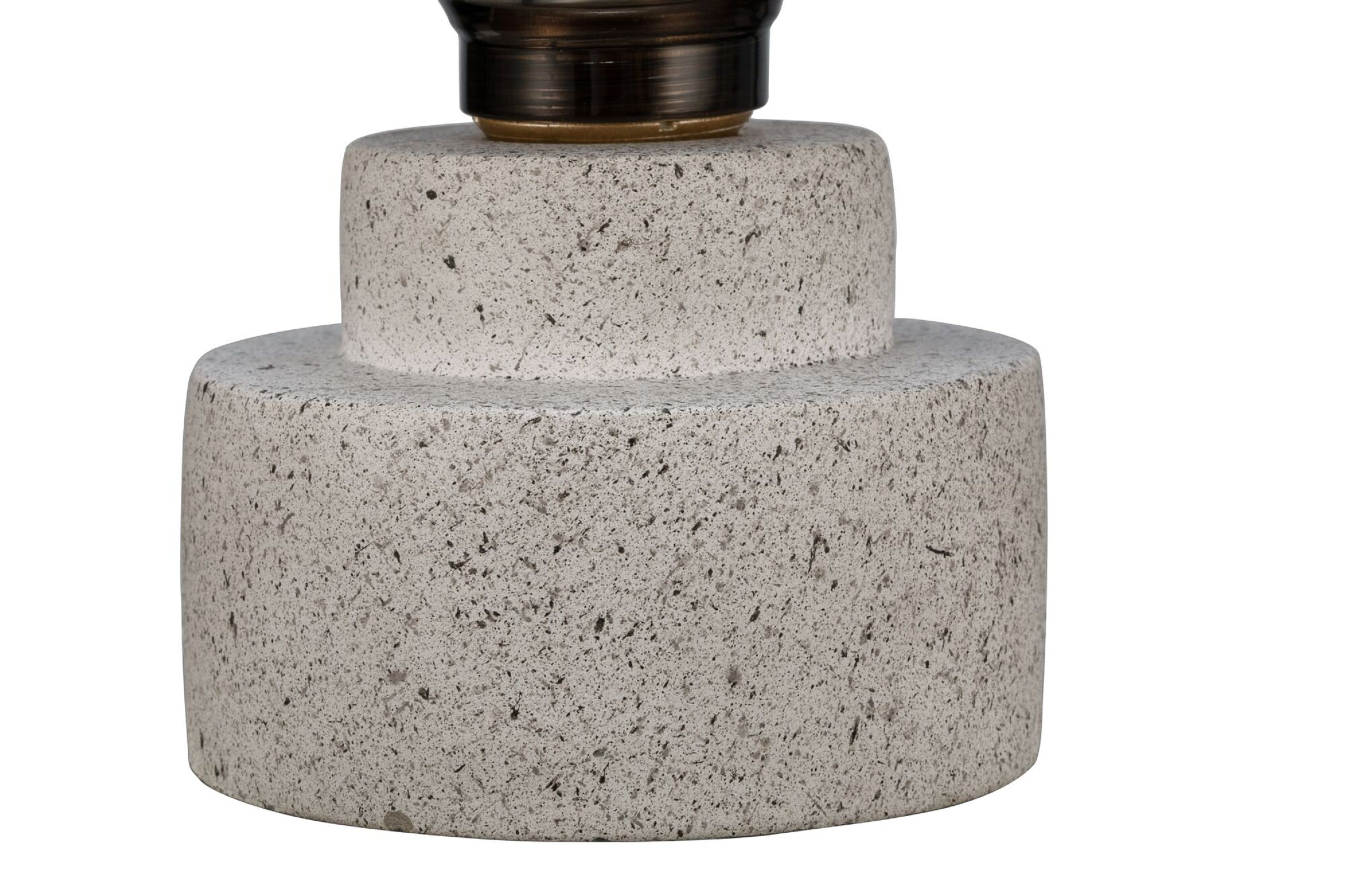 Dwupoziomowa, kamienista podstawa lampy na białym tle.