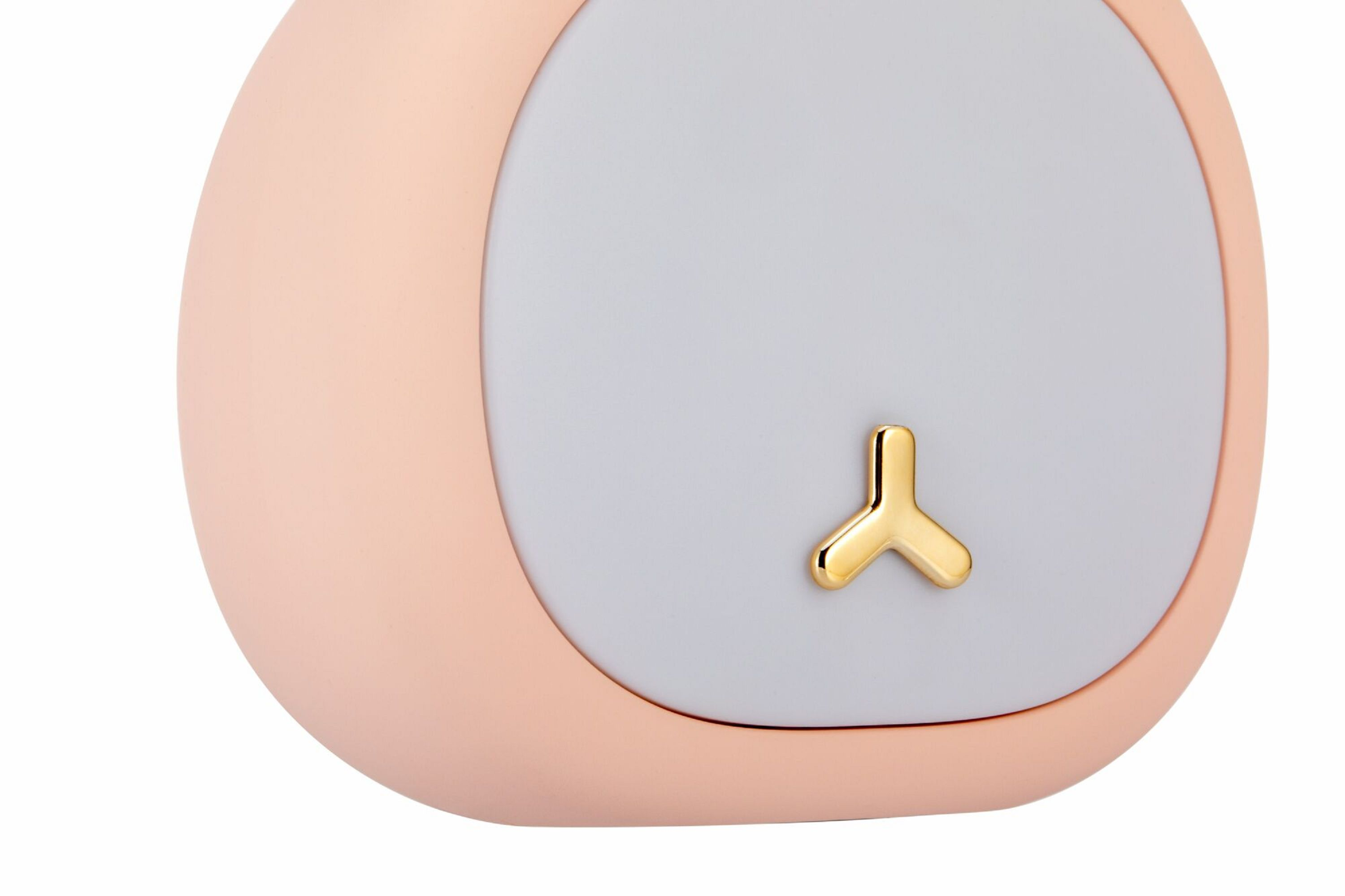 Nahaufnahme eines rosa-grauen Geräts mit Goldakzent. Sieht nach Smart Device aus.