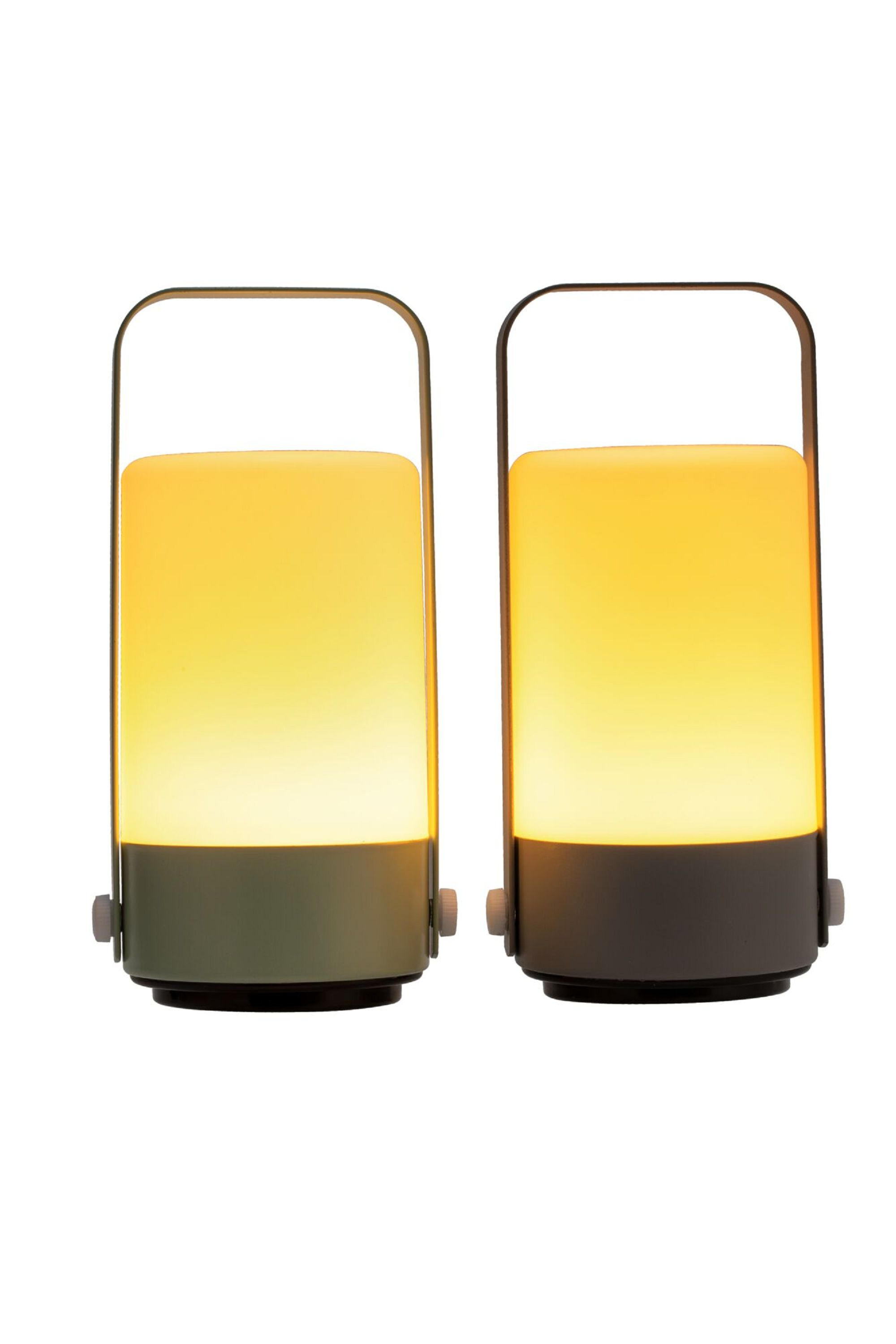 Dwie prostokątne lampy z uchwytami, świecące ciepłym światłem, na białym tle.