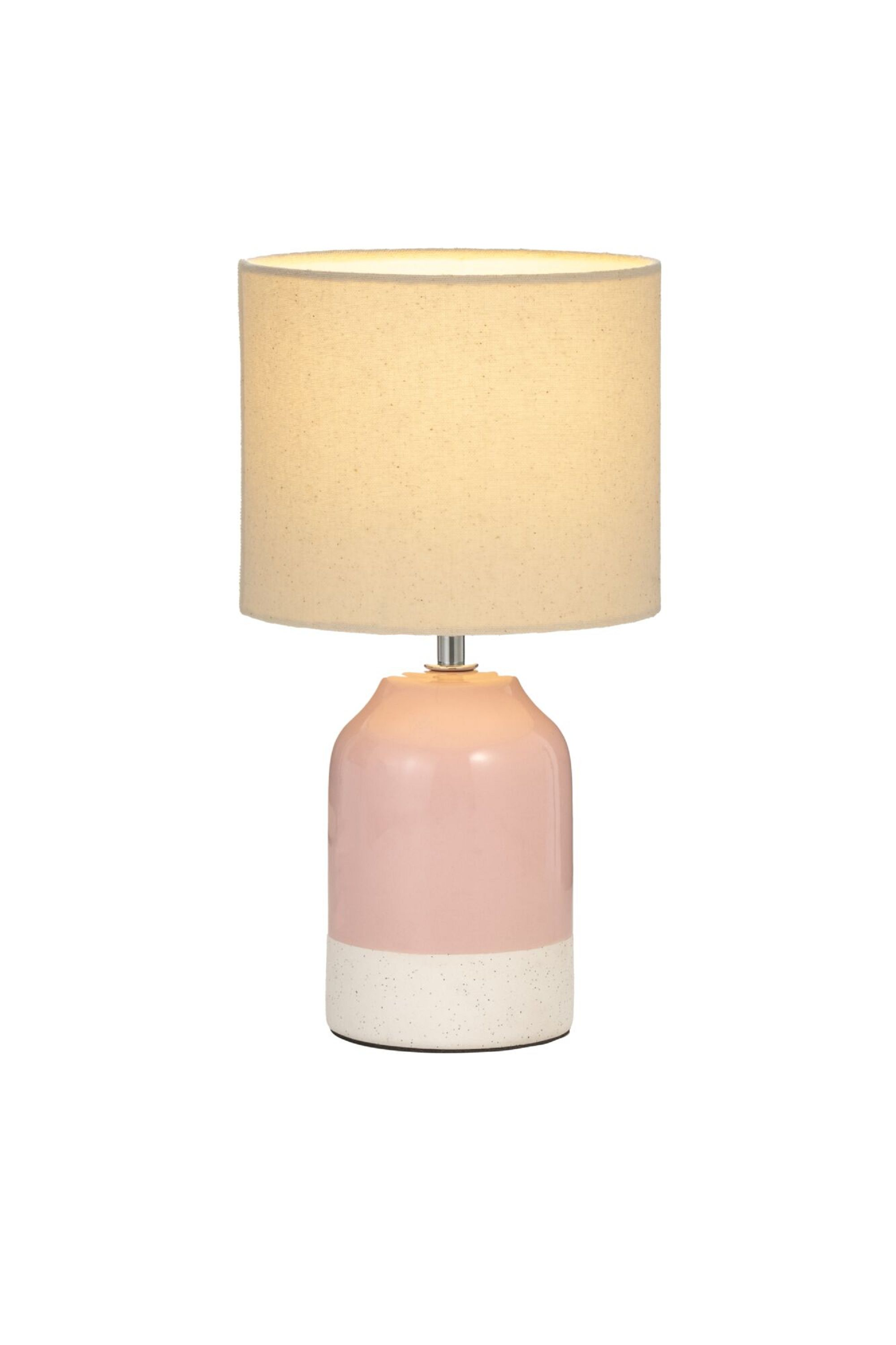 Różowo-biała lampa z beżowym kloszem.