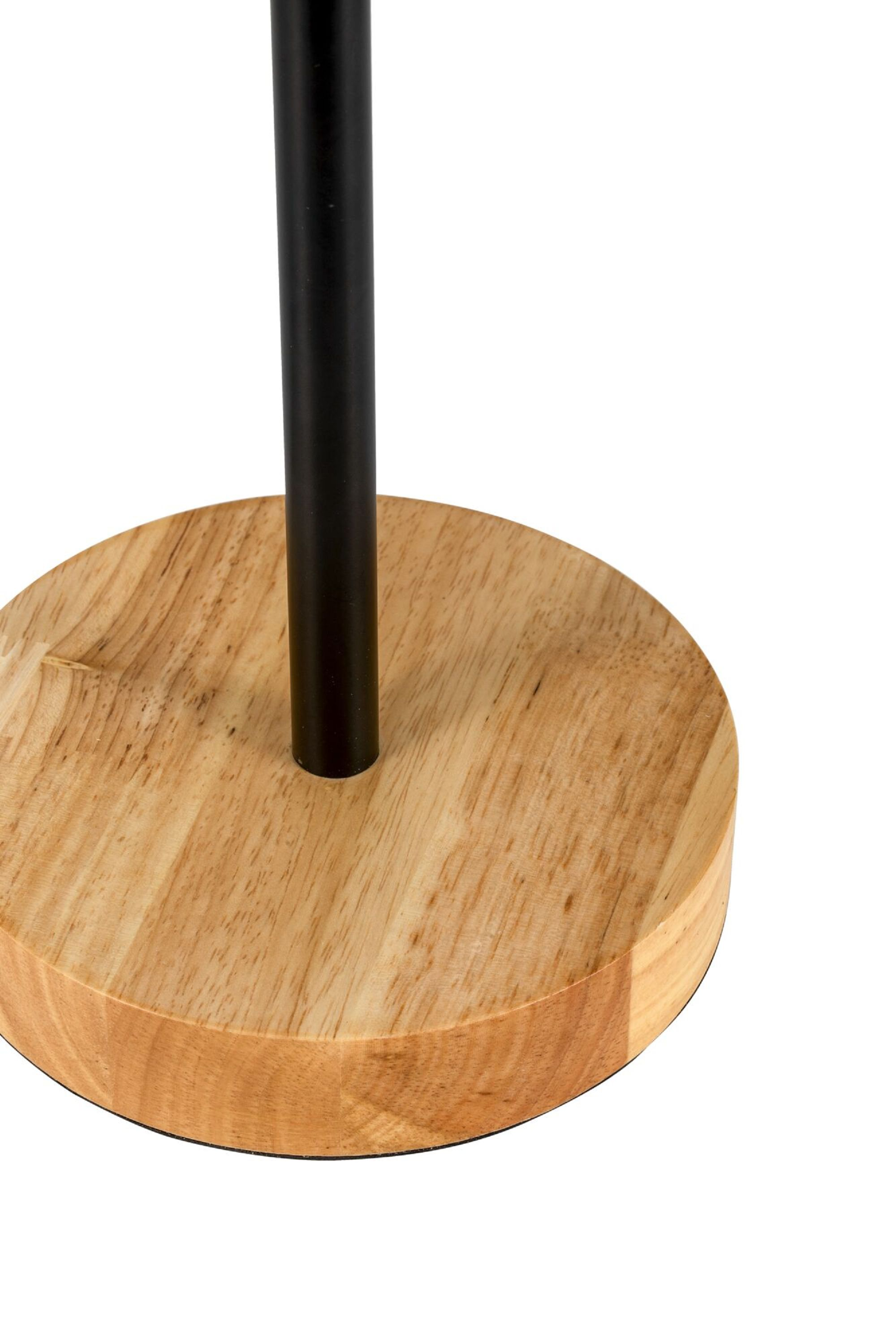 Drewniana podstawa lampy z czarnym słupkiem, na białym tle.