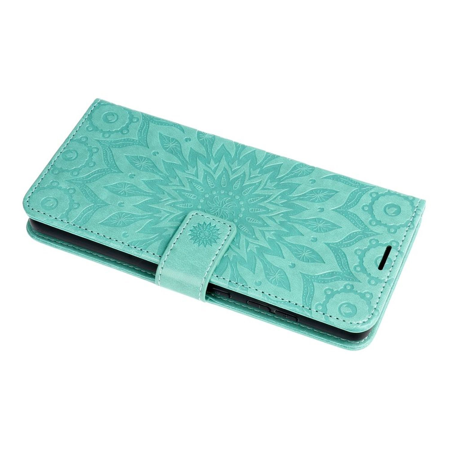 Türkisfarbene Handyhülle mit floralem Design, offen. Hat einen Magnetverschluss.
