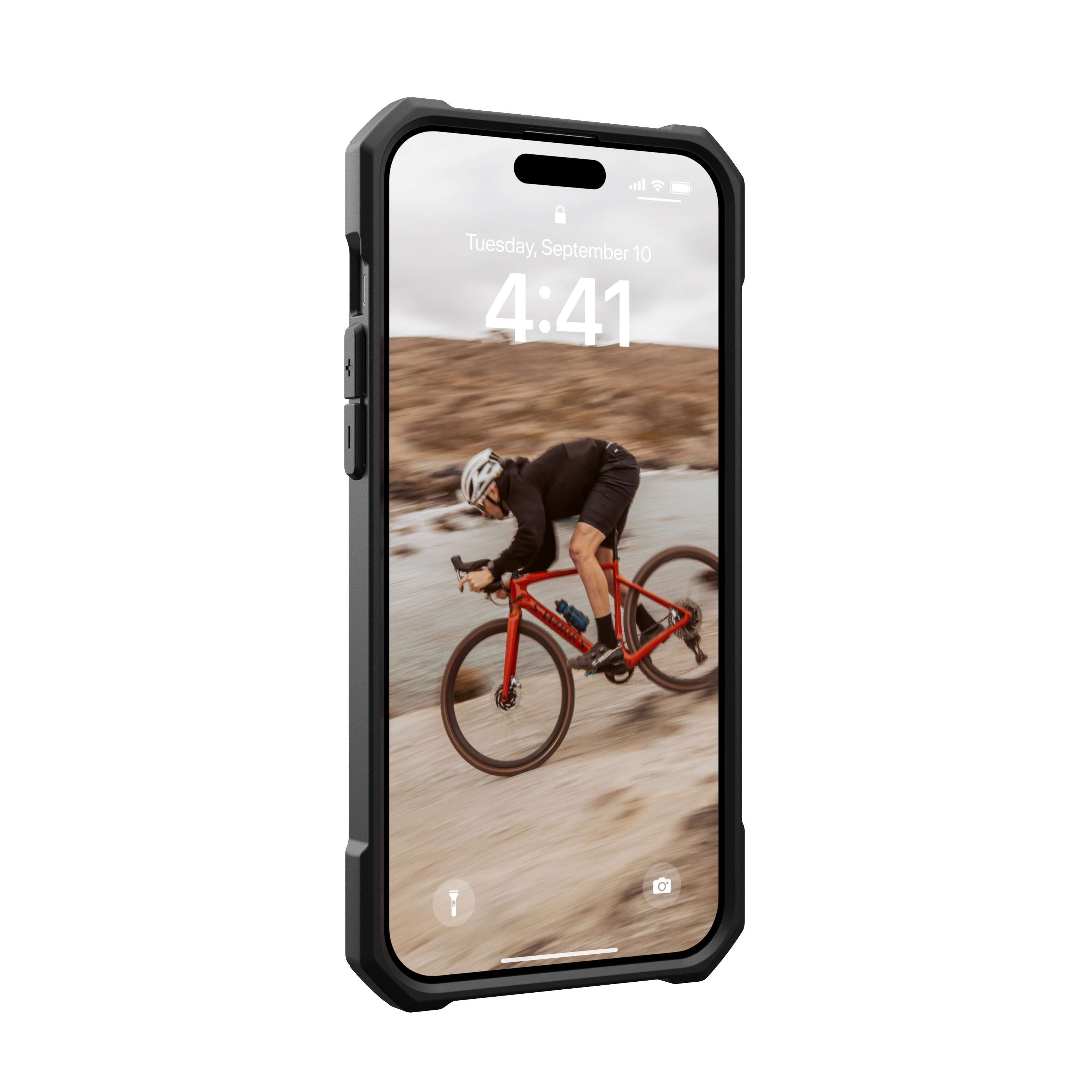 Telefon in Hülle, zeigt Radfahrer auf rotem Rad in felsiger Landschaft.