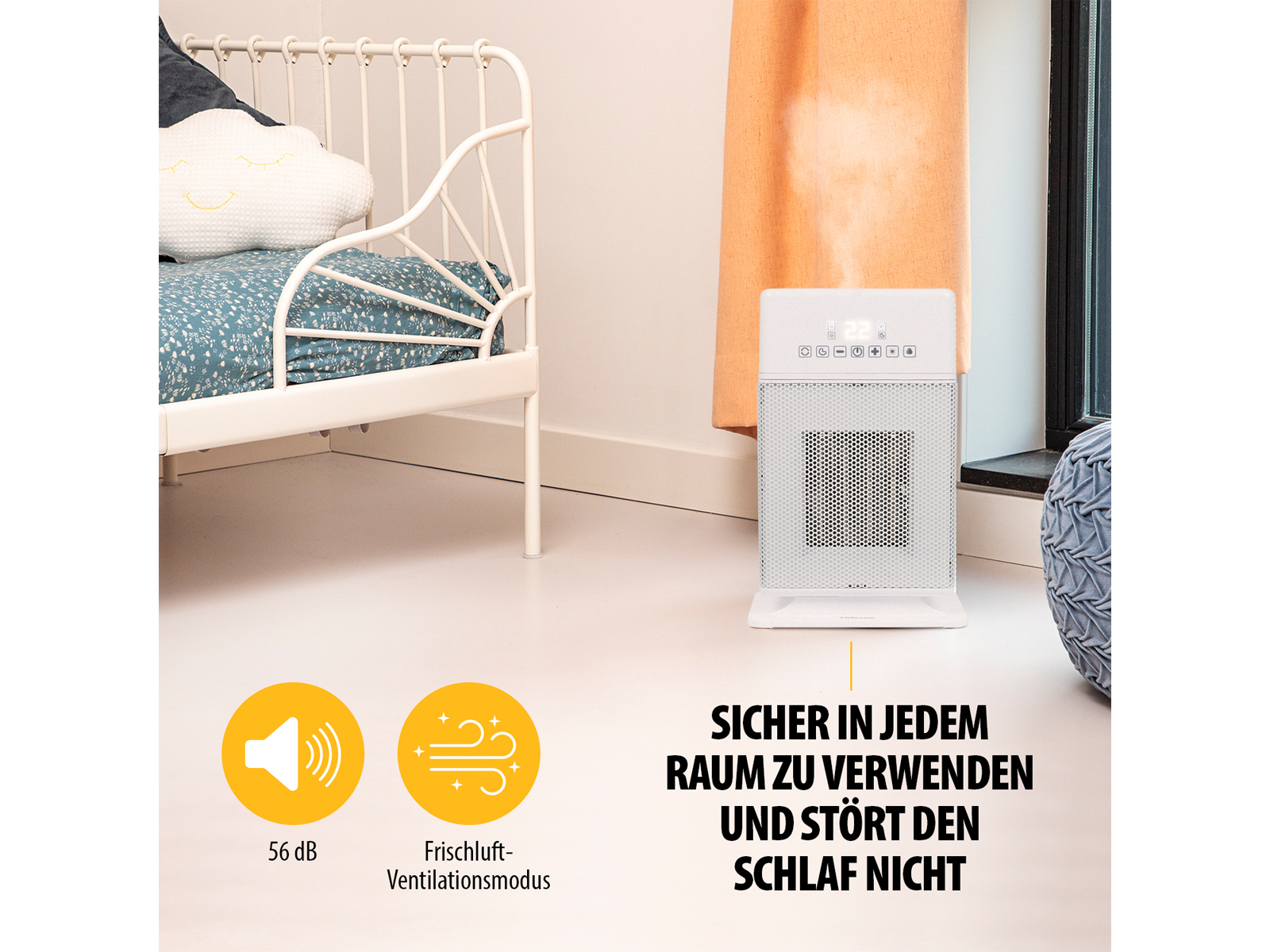 Ein weißer Heizlüfter neben einem Bett. Er hat ein Display und Luftschlitze.