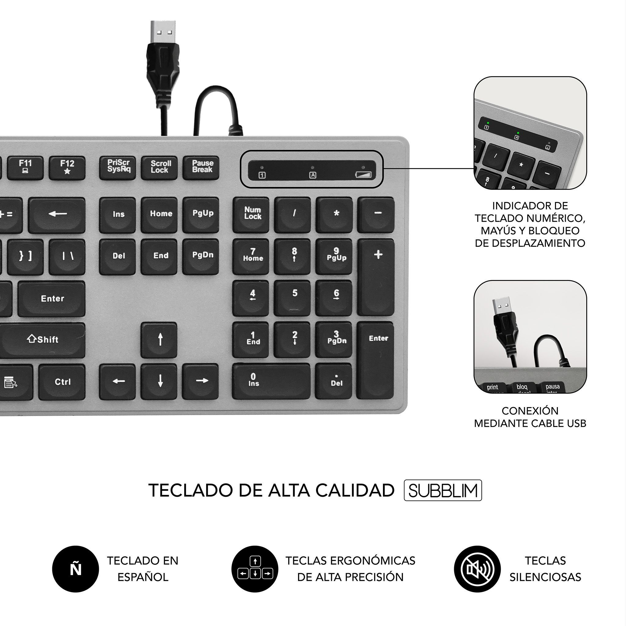 Teclado plateado con teclas negras, diseño español, fondo blanco.