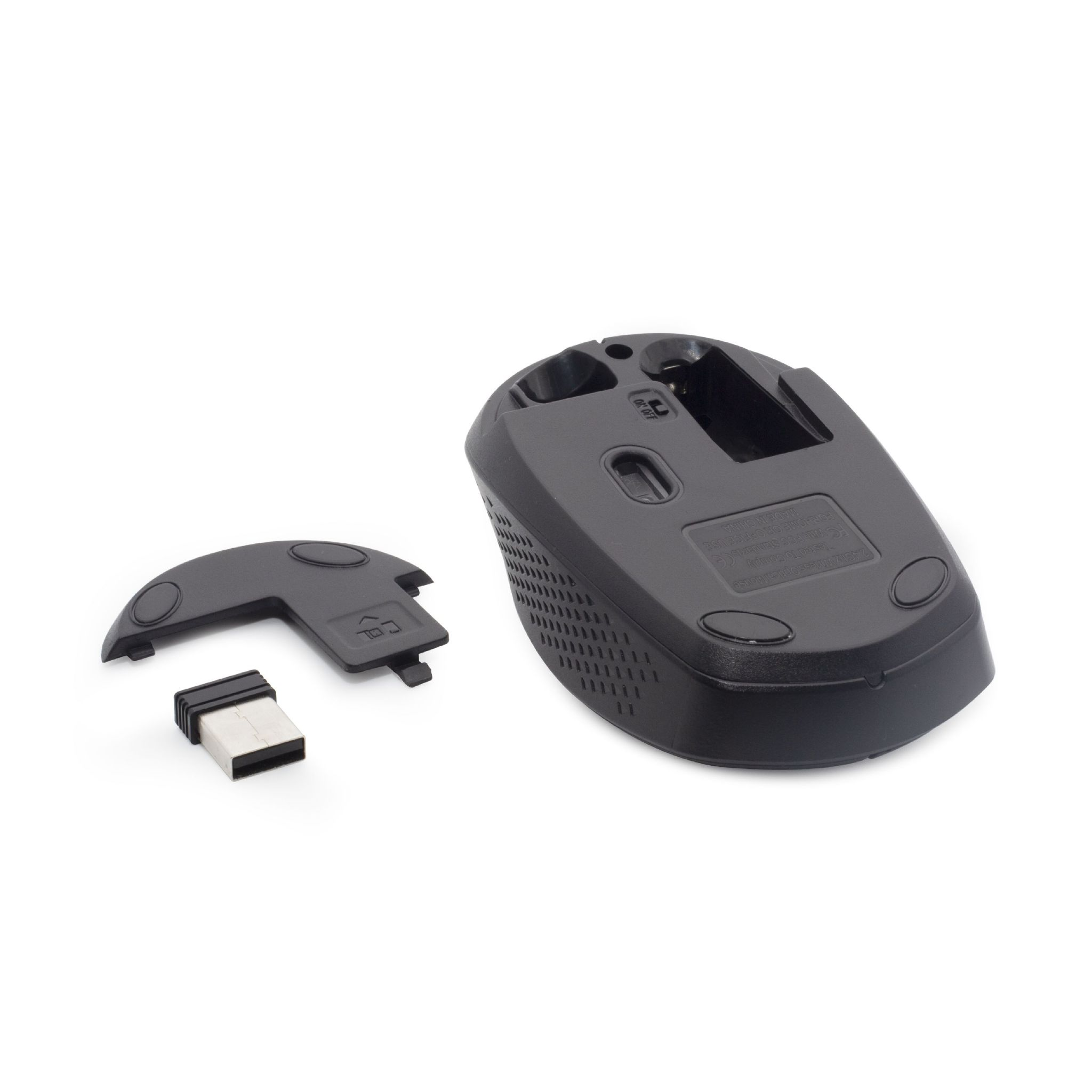Base de ratón negro y cubierta desmontable. Receptor USB también presente, todo sobre superficie blanca.