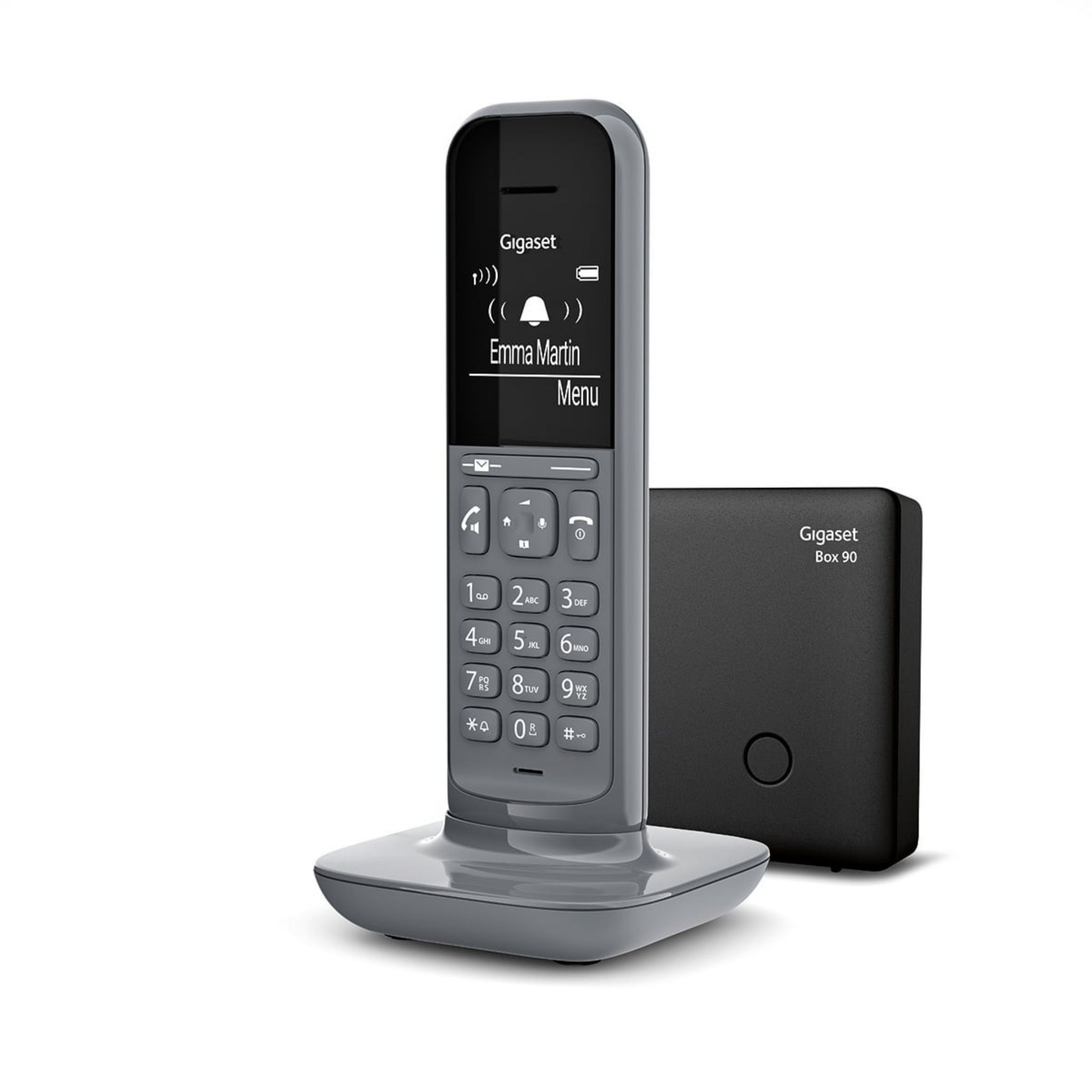 Un teléfono inalámbrico Gigaset gris con base, sobre blanco. La pantalla muestra un nombre.