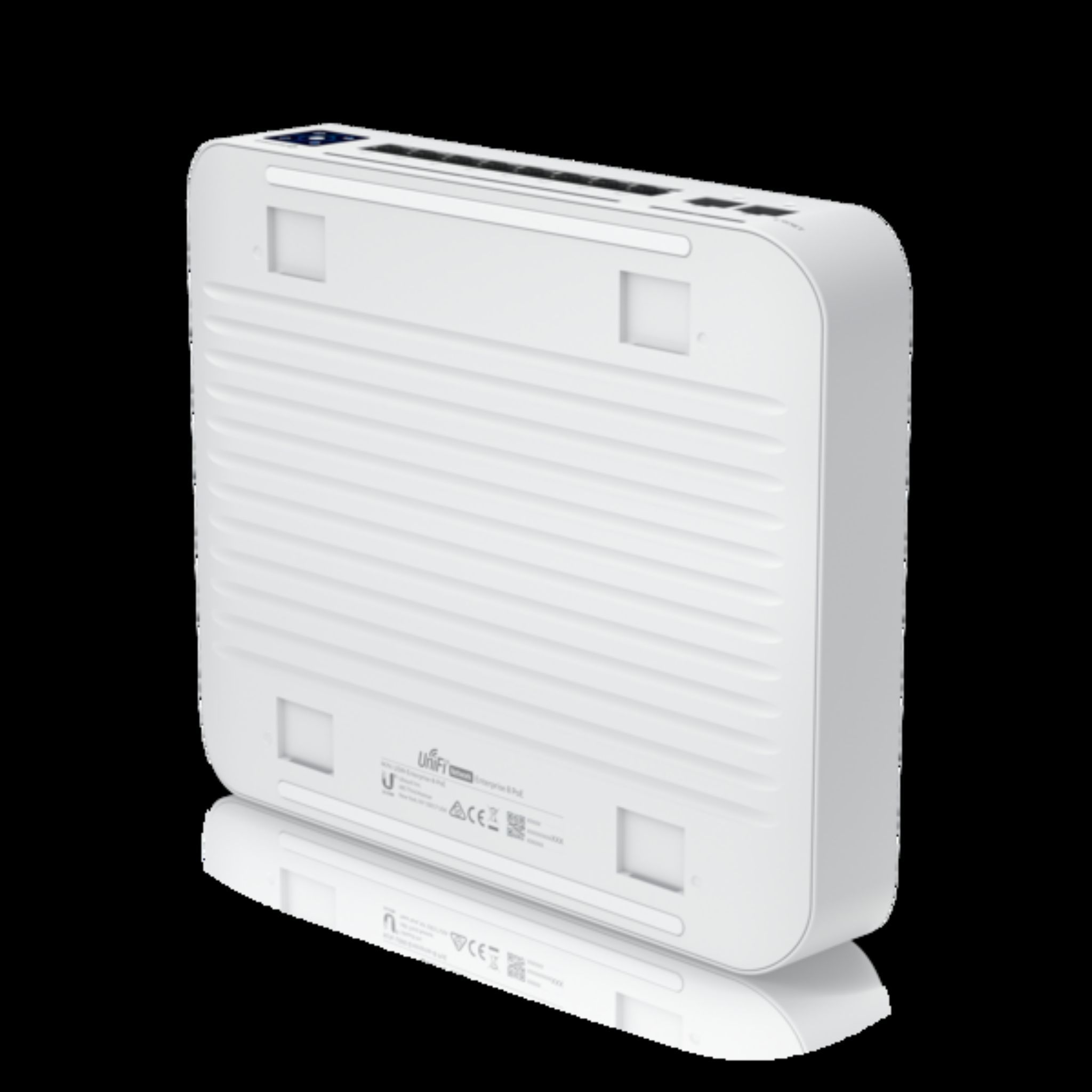 Un dispositivo di rete Unifi bianco, vista dal basso. È rettangolare con una superficie scanalata e porte visibili sul lato.