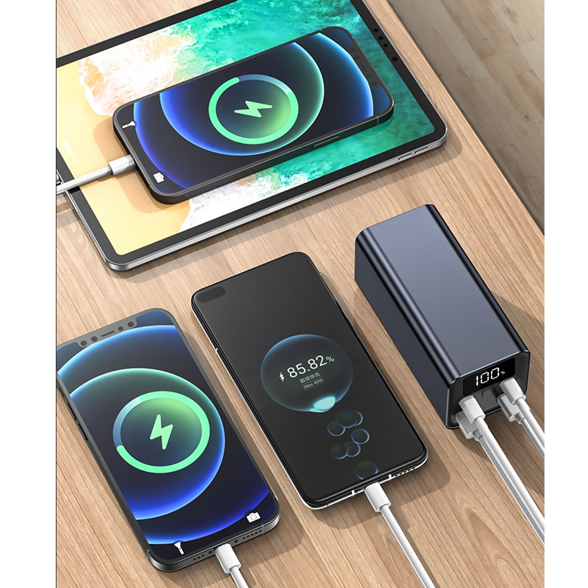 Dispositivos cargando en un banco de energía, mesa de madera, power bank azul.