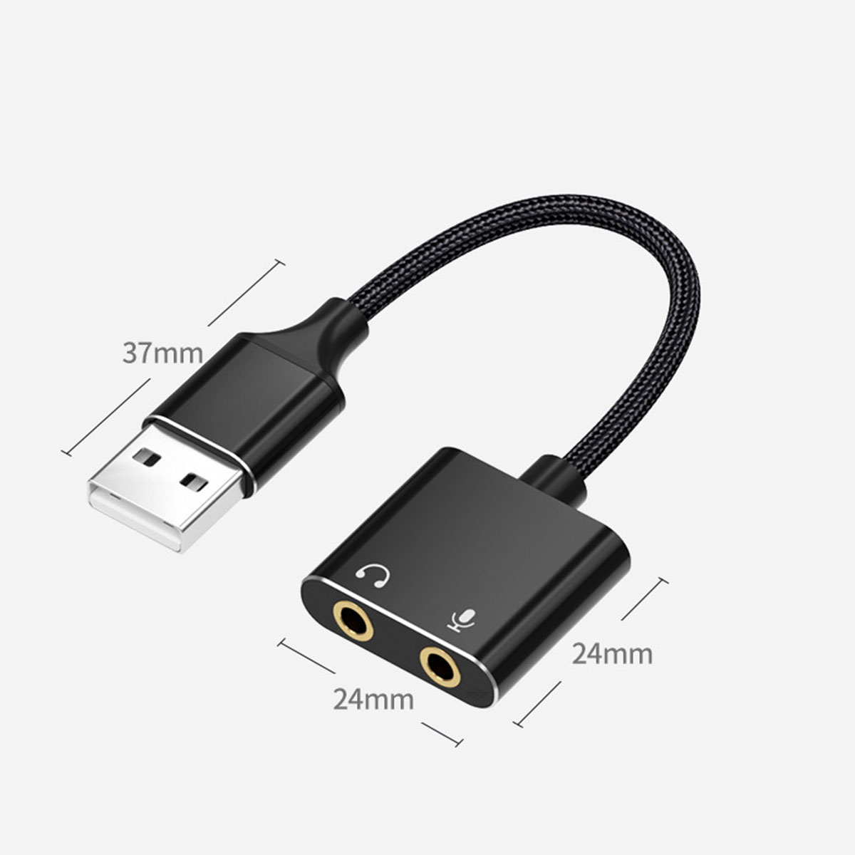 Ein schwarzer Adapter mit USB-Anschluss und zwei Audioanschlüssen, mit Maßen.