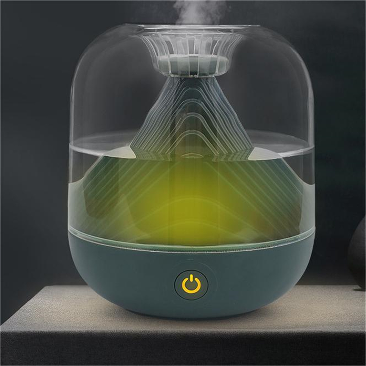 Difusor de aromas con tapa transparente, con interior verde iluminado.