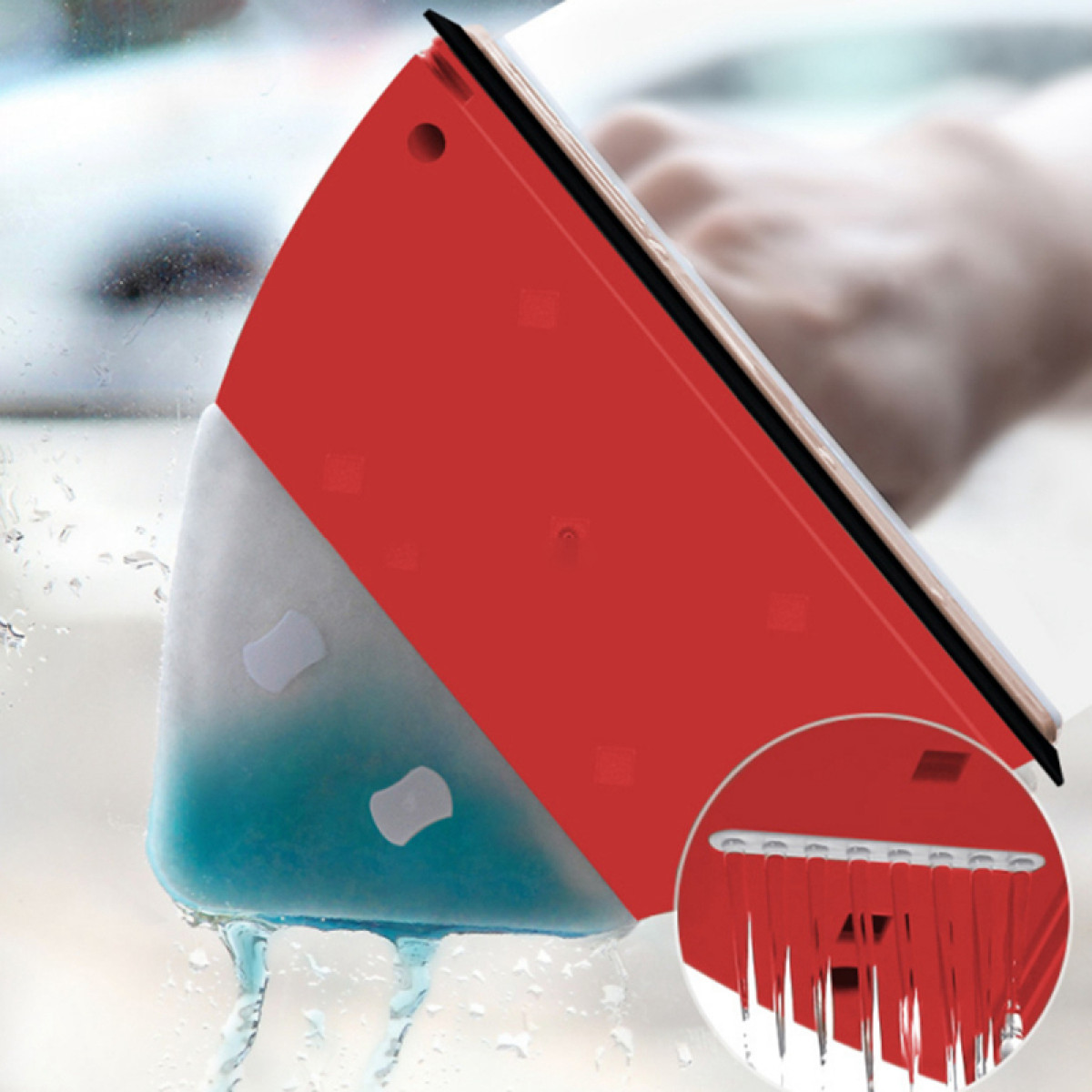 Un lave-vitre rouge avec un côté de nettoyage bleu, nettoyant une fenêtre.