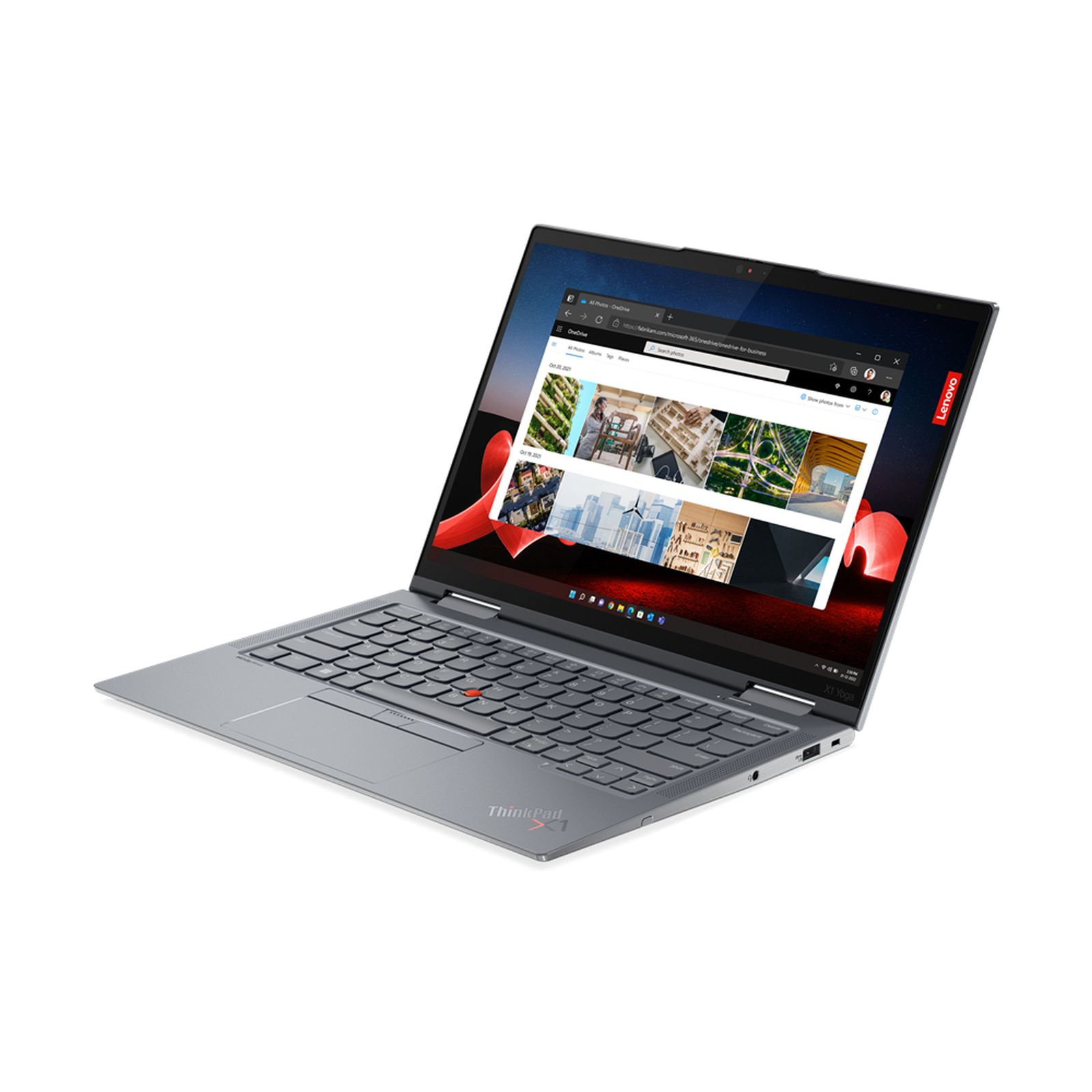 Laptop Lenovo ThinkPad argentato con schermo aperto che mostra un sito web.