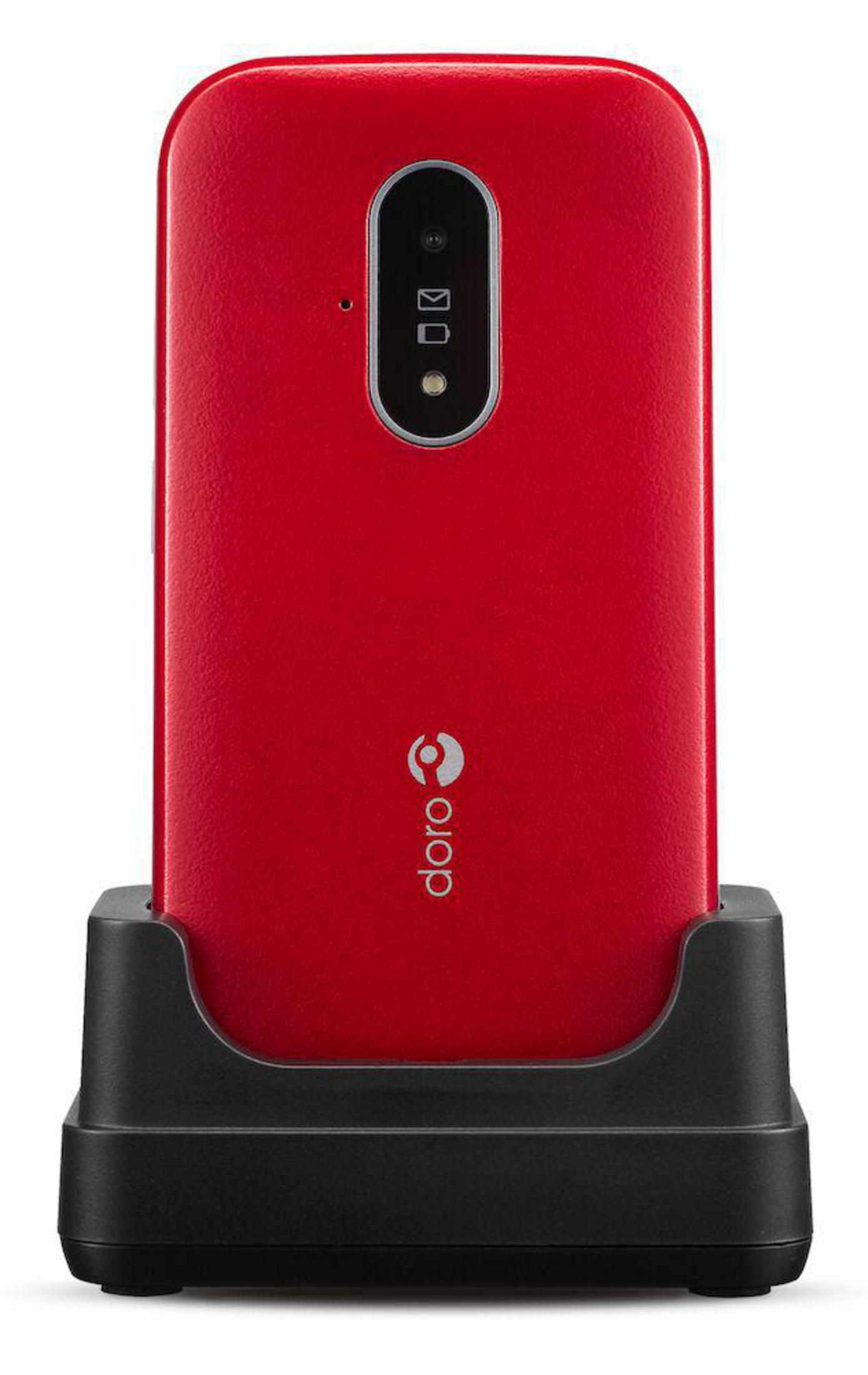 Czerwony telefon komórkowy na czarnej stacji ładującej. Telefon ma aparat i logo Doro.