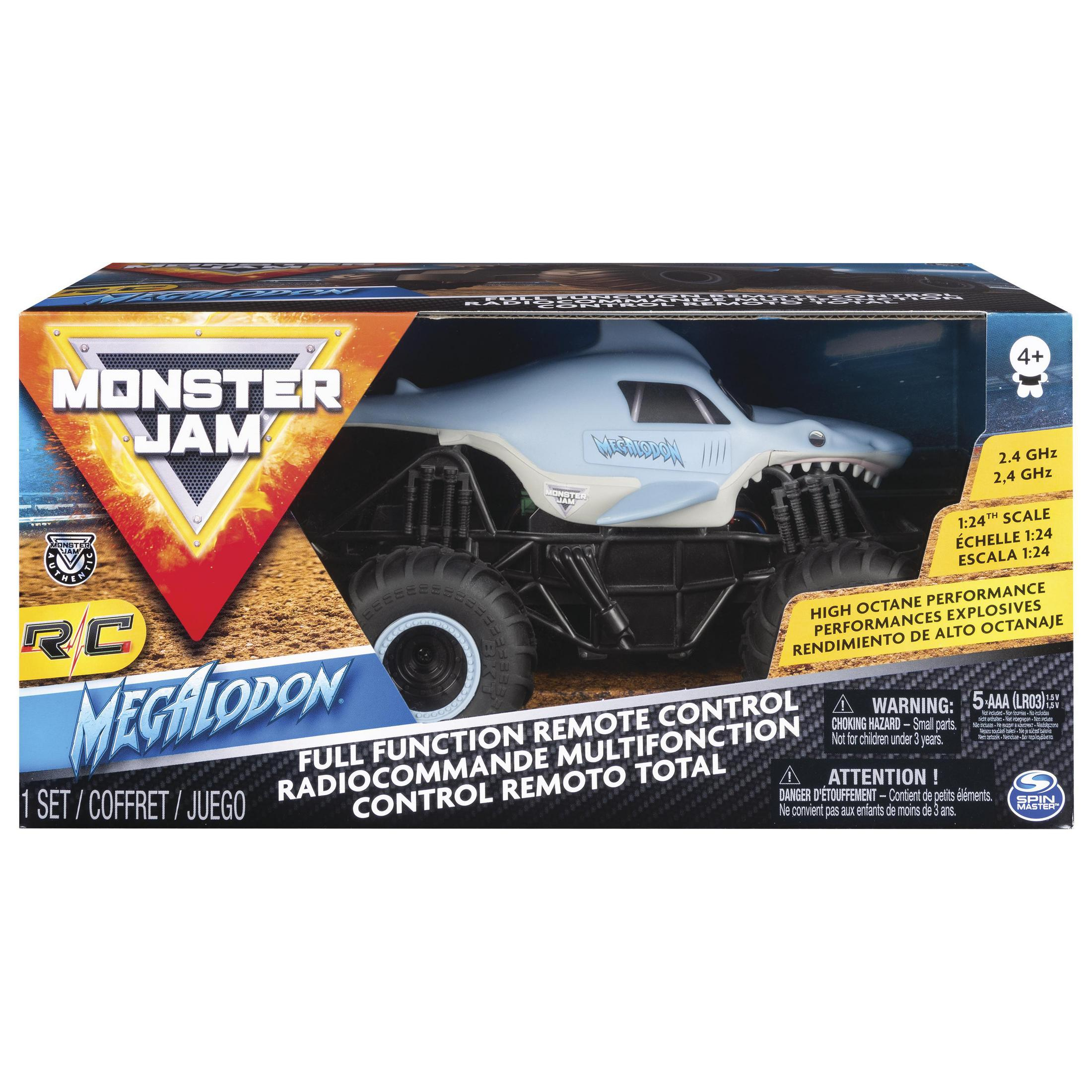 Embalaje de juguete Monster Jam con un camión tiburón azul, texto y advertencias.