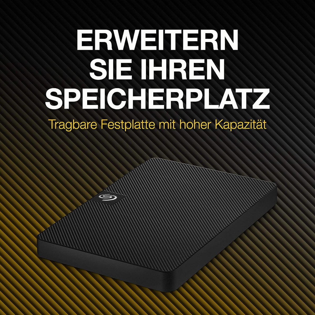 Czarny dysk zewnętrzny na żółtym tle, biały tekst: Rozszerz swoją pamięć.