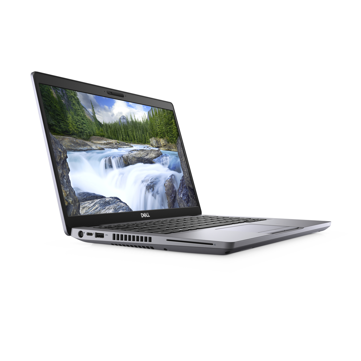A silver Dell laptop is open on a white surface. The screen displays a natural landscape with a waterfall.