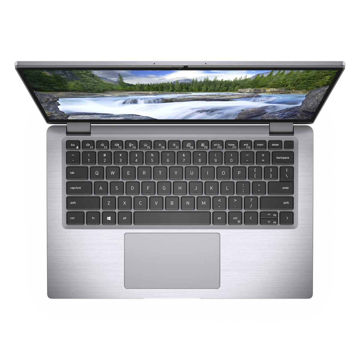 Laptop top view, open on white surface, displaying a landscape image on the screen.