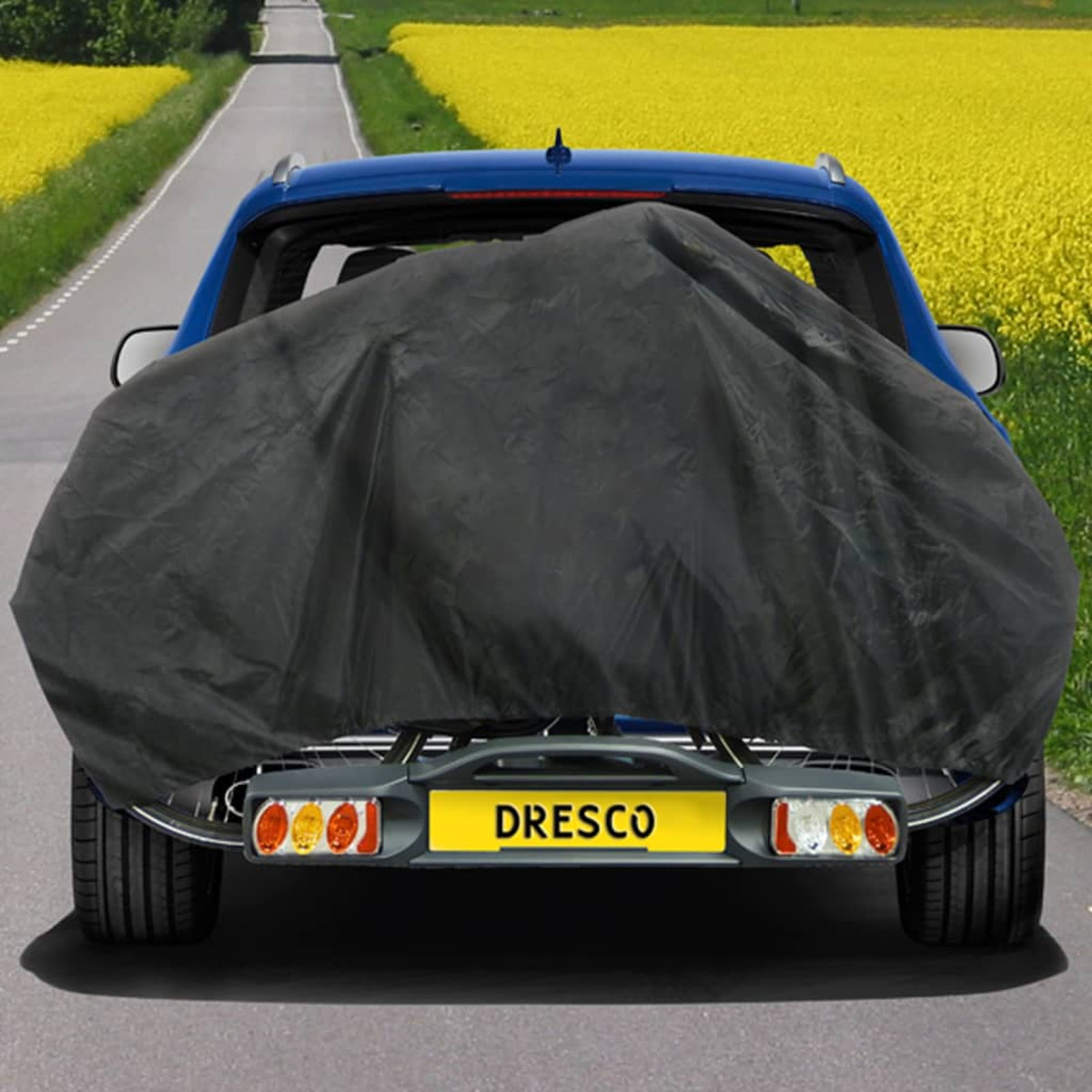 Blaues Auto mit schwarzer Abdeckung hinten.