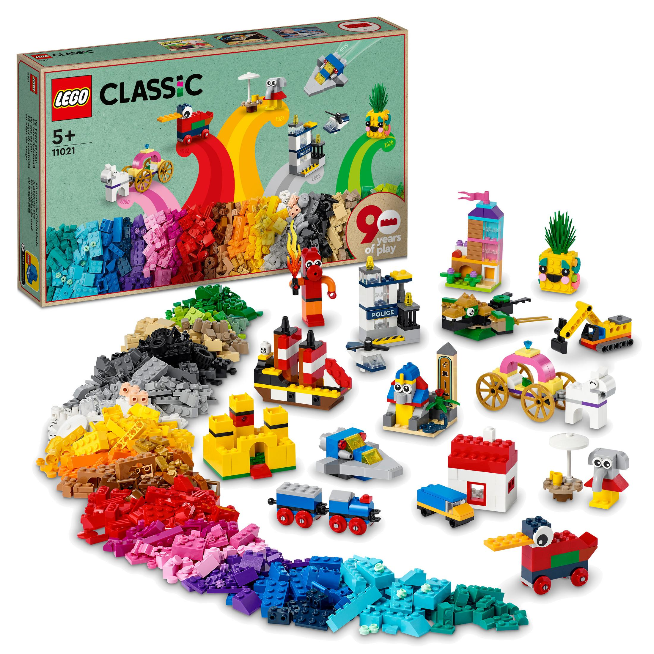 Gökkuşağı, kale ve diğer yapılar dahil olmak üzere çeşitli modeller ve tuğlalarla renkli LEGO Classic seti.