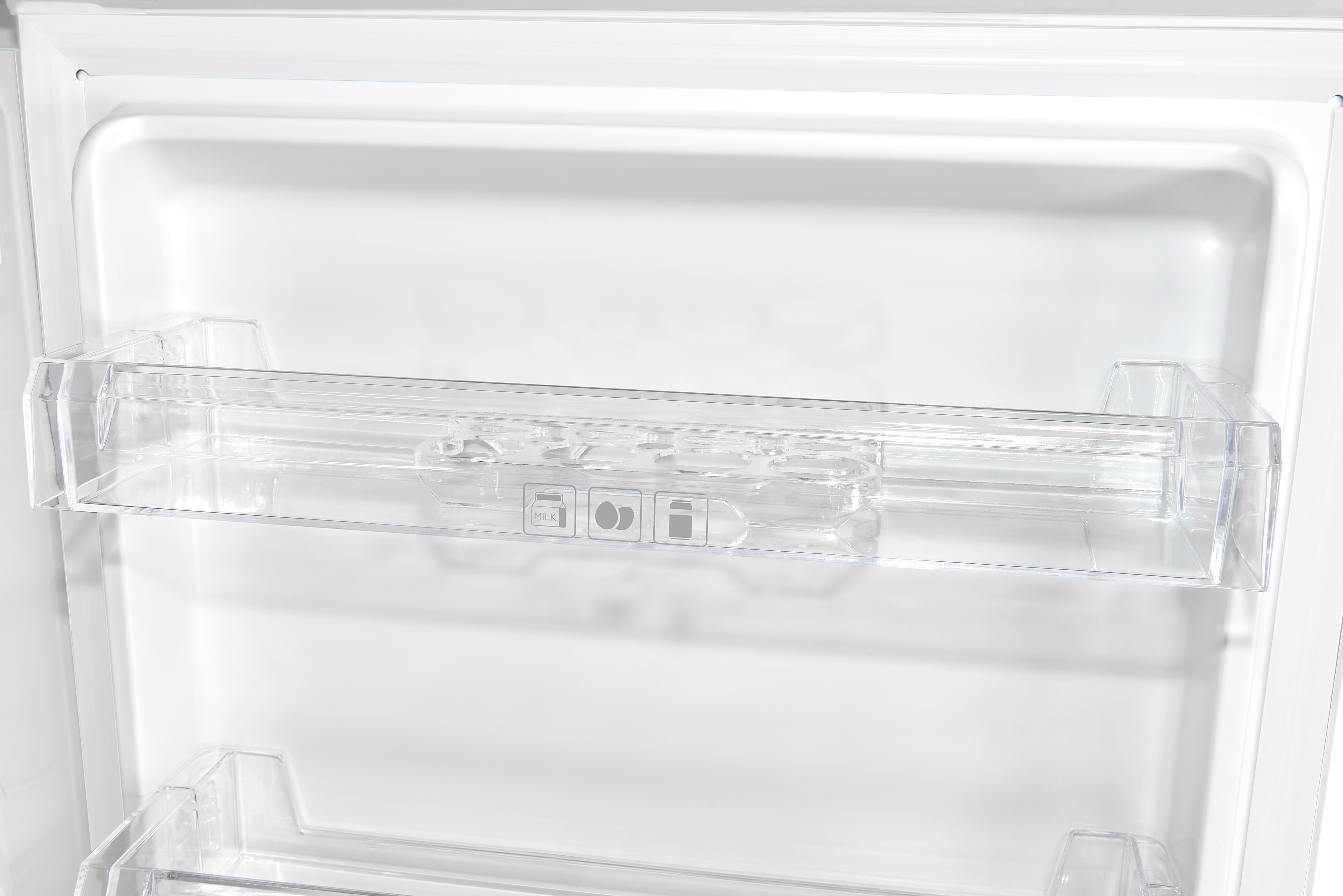 Inside of a fridge with transparent shelves and storage compartments. White interior.