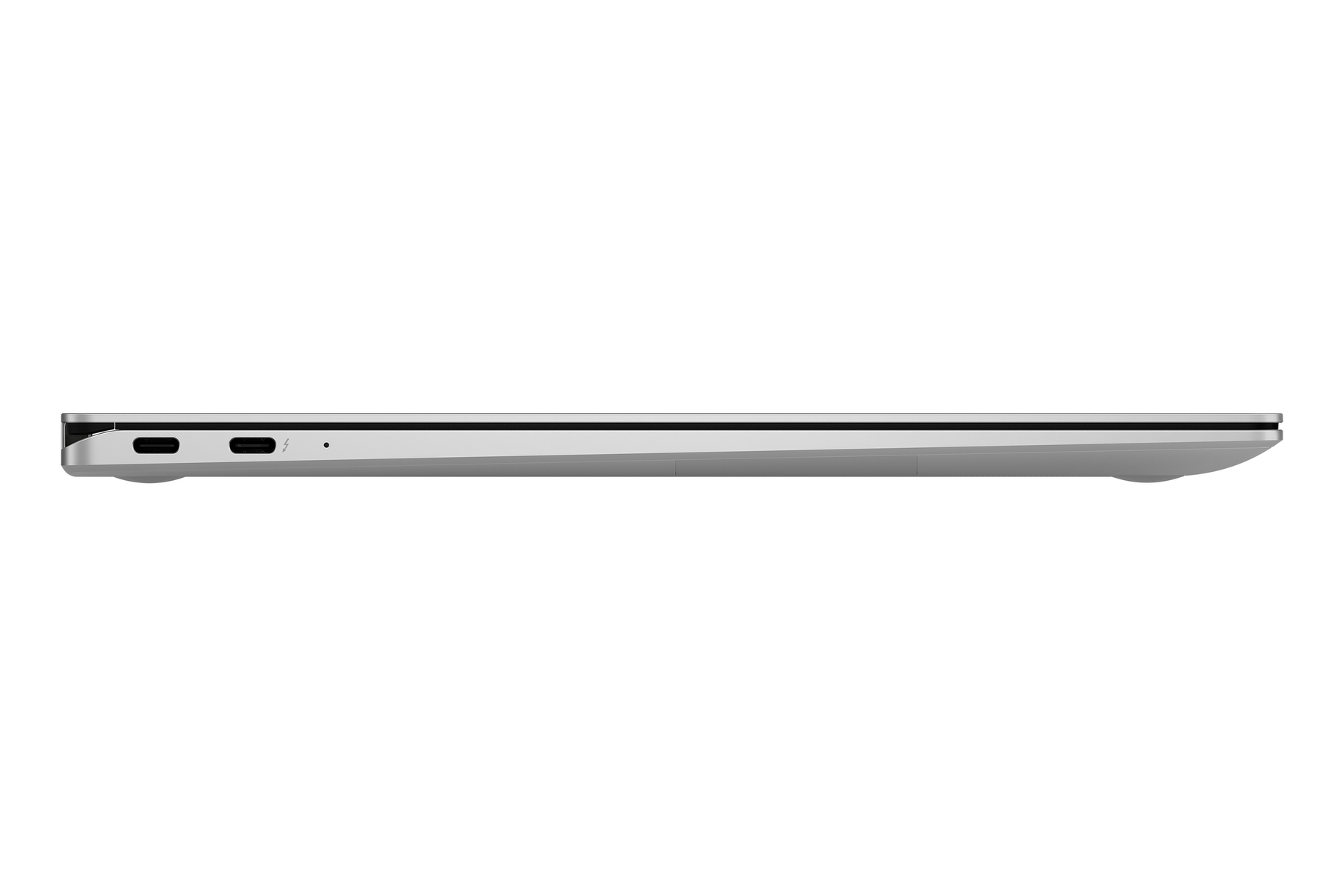 Seitenansicht eines silbernen Laptops mit Anschlüssen und schlankem Design. Eine elegante, minimalistische Ästhetik.