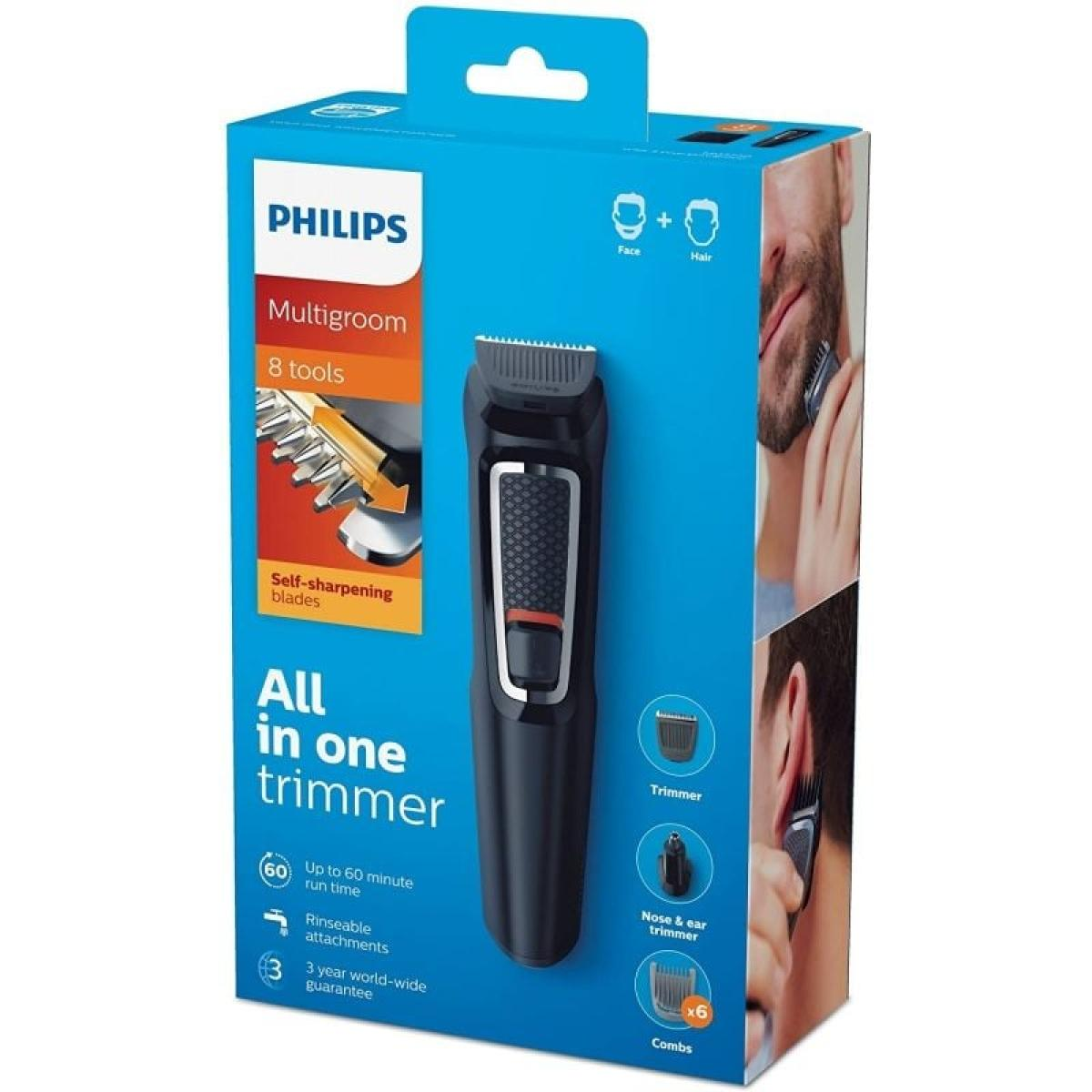 Box von Philips Multigroom All-in-One Trimmer. Die Box zeigt den Trimmer und verschiedene Aufsätze.