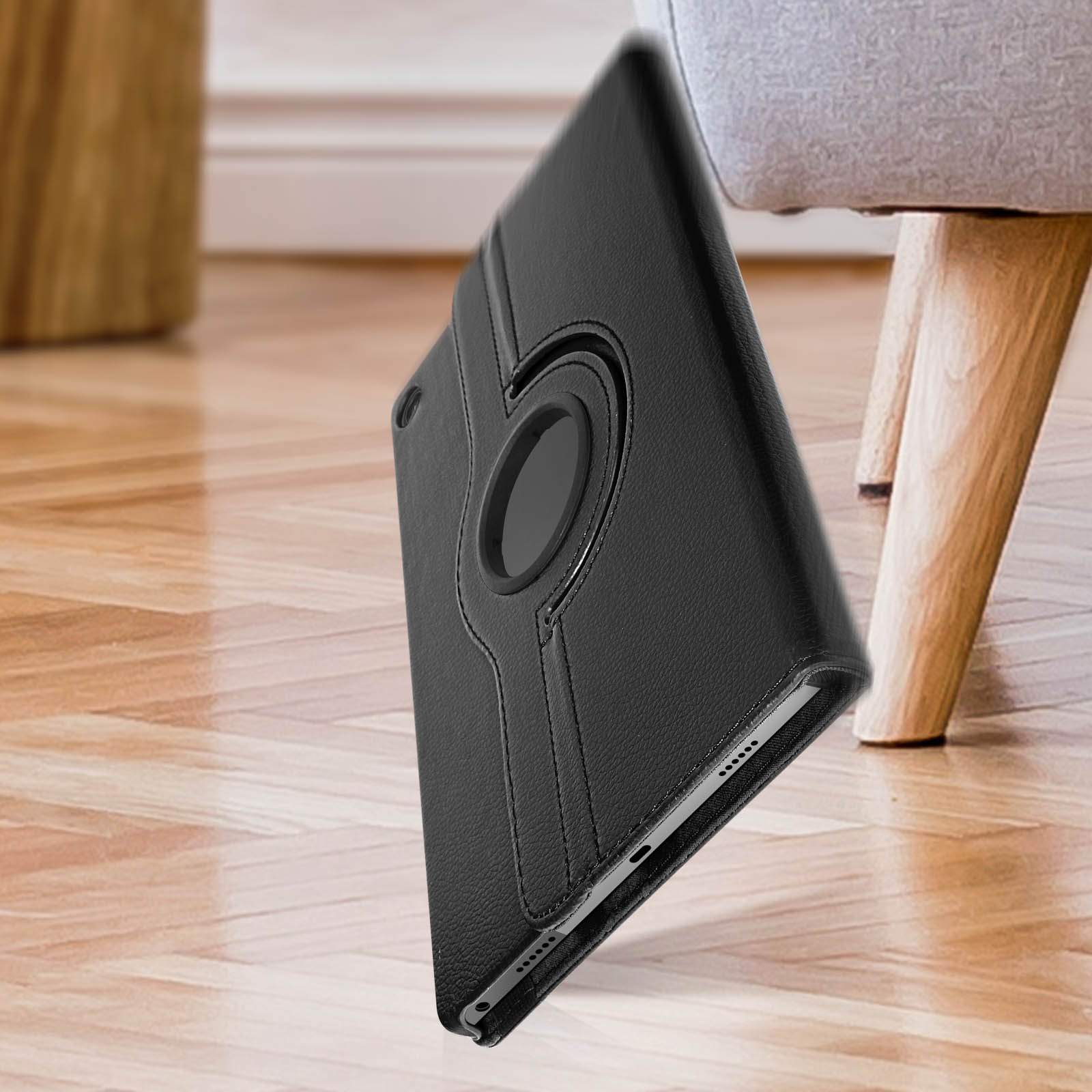 Custodia per tablet nera con supporto ad anello girevole.