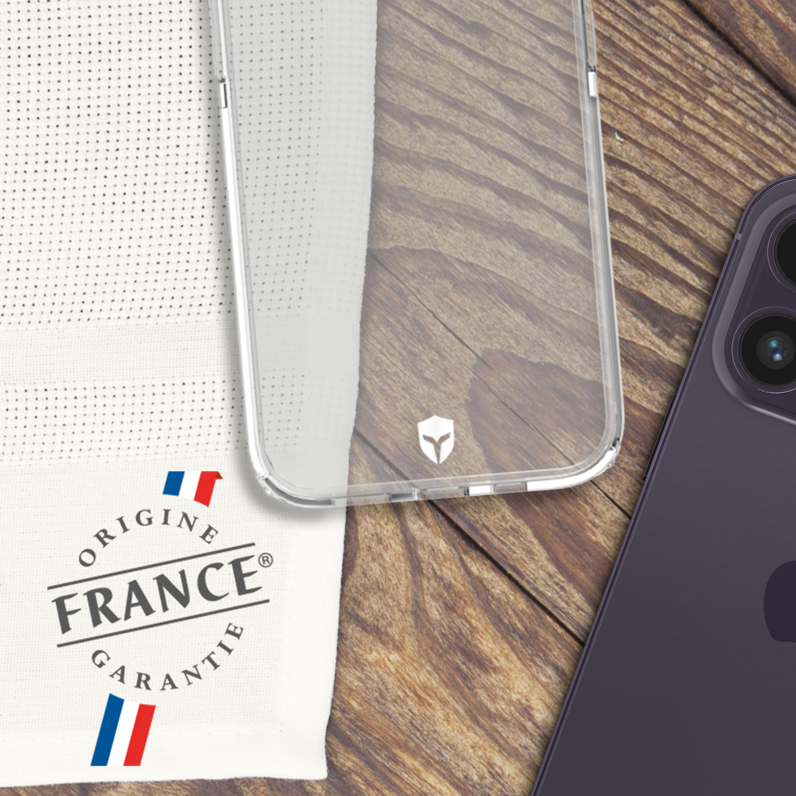 Custodia per telefono trasparente, panno bianco con ‘Origine France Garantie’ e un telefono viola.