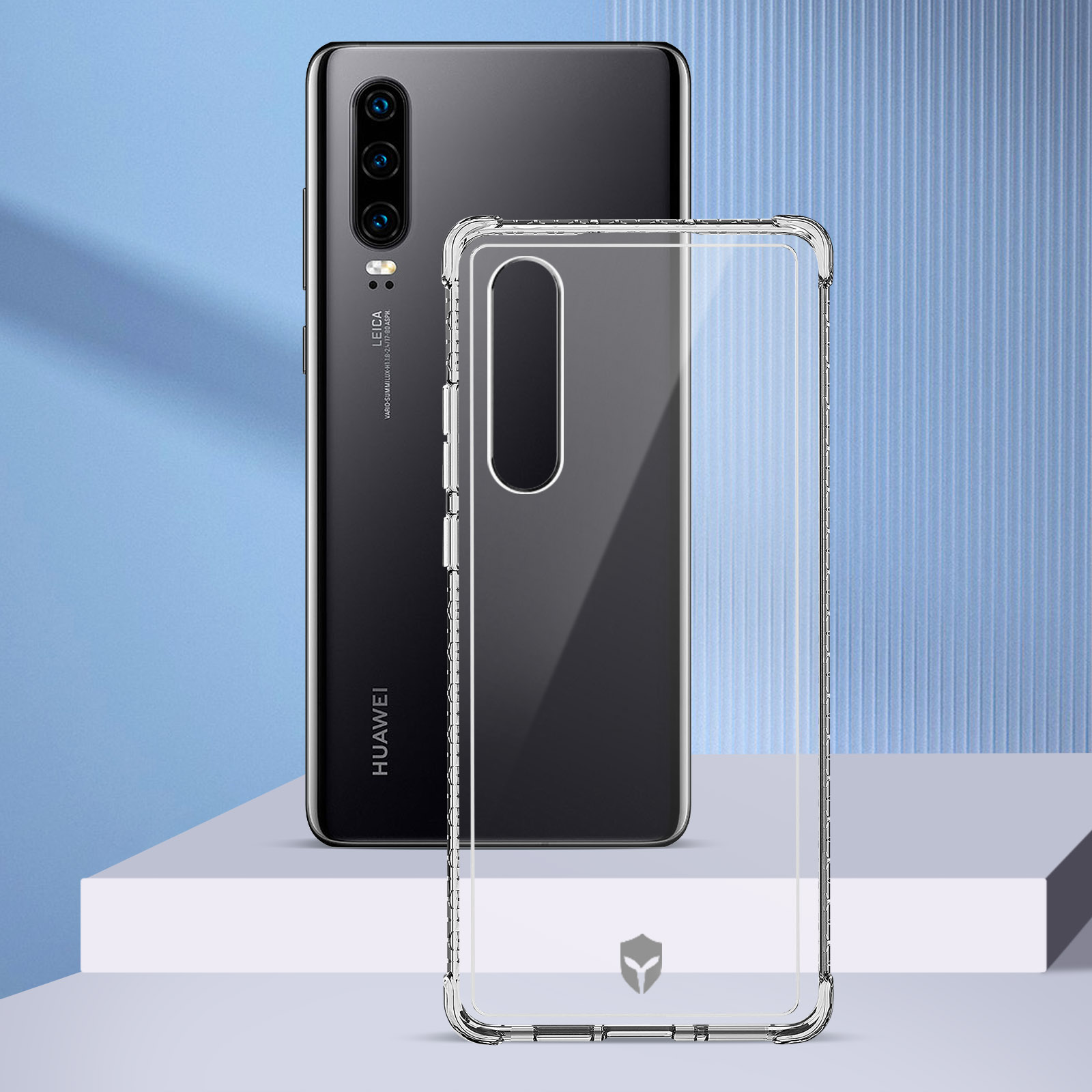 Un téléphone noir et une coque transparente. La coque sur une surface blanche. Le téléphone est sur un support.