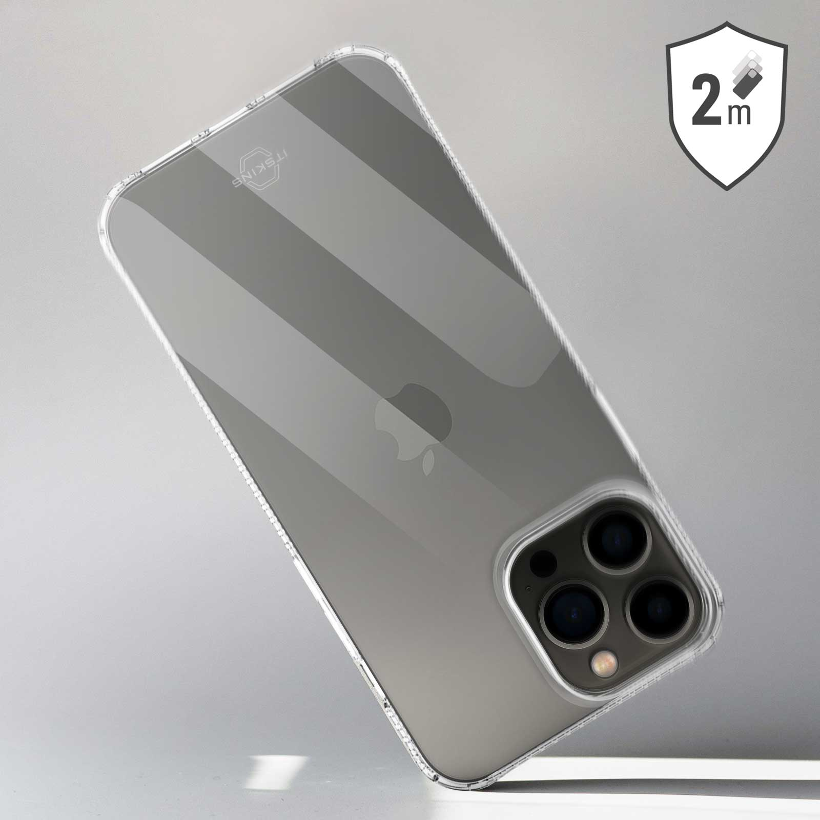 Custodia trasparente per telefono su superficie. Logo Apple visibile. Etichetta 2m.