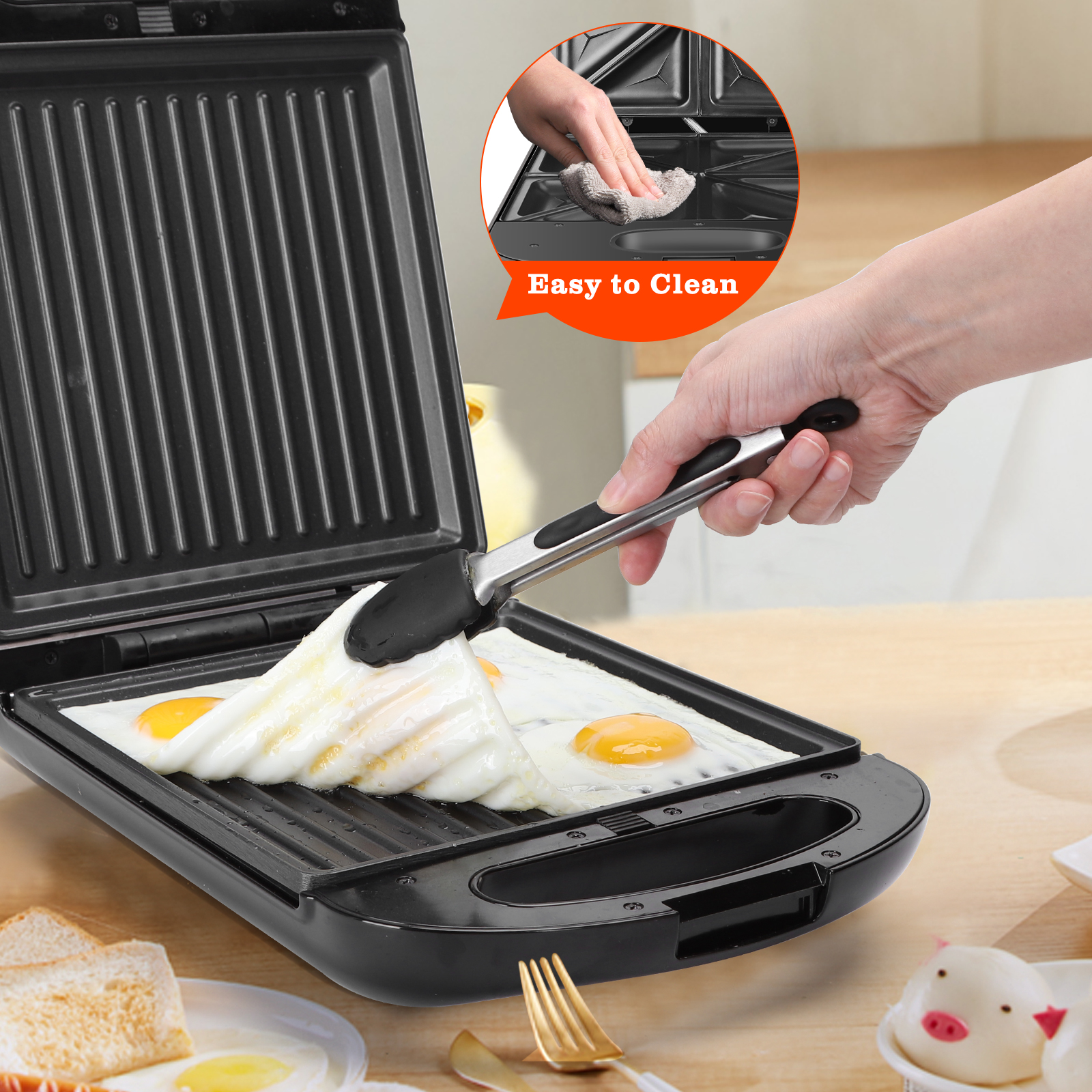 Una persona usa pinzas para voltear huevos en una sandwichera. La etiqueta 'Easy to Clean' es visible.