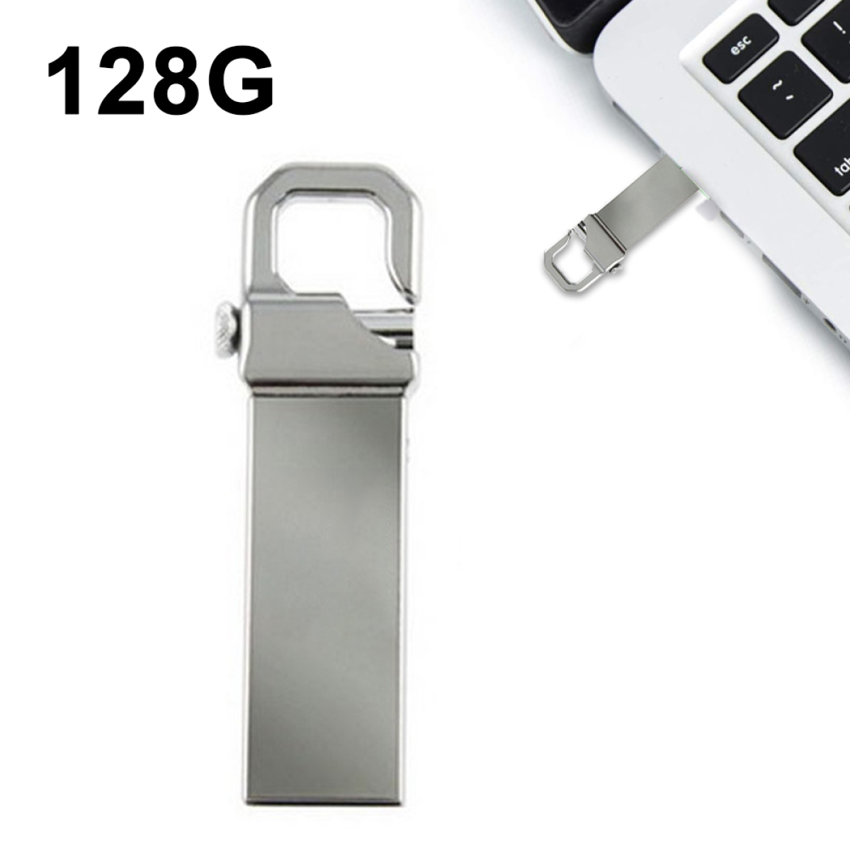 Silberner 128G USB-Stick neben einem Laptop. Der Stick hat eine Schlaufe und ein silbernes Gehäuse.