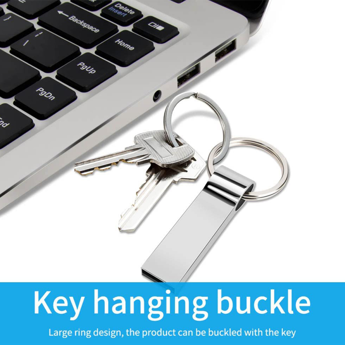 Ein Schlüssel und ein USB-Stick an einem Schlüsselring neben einer Laptop-Tastatur. Der Text lautet Key hanging buckle.